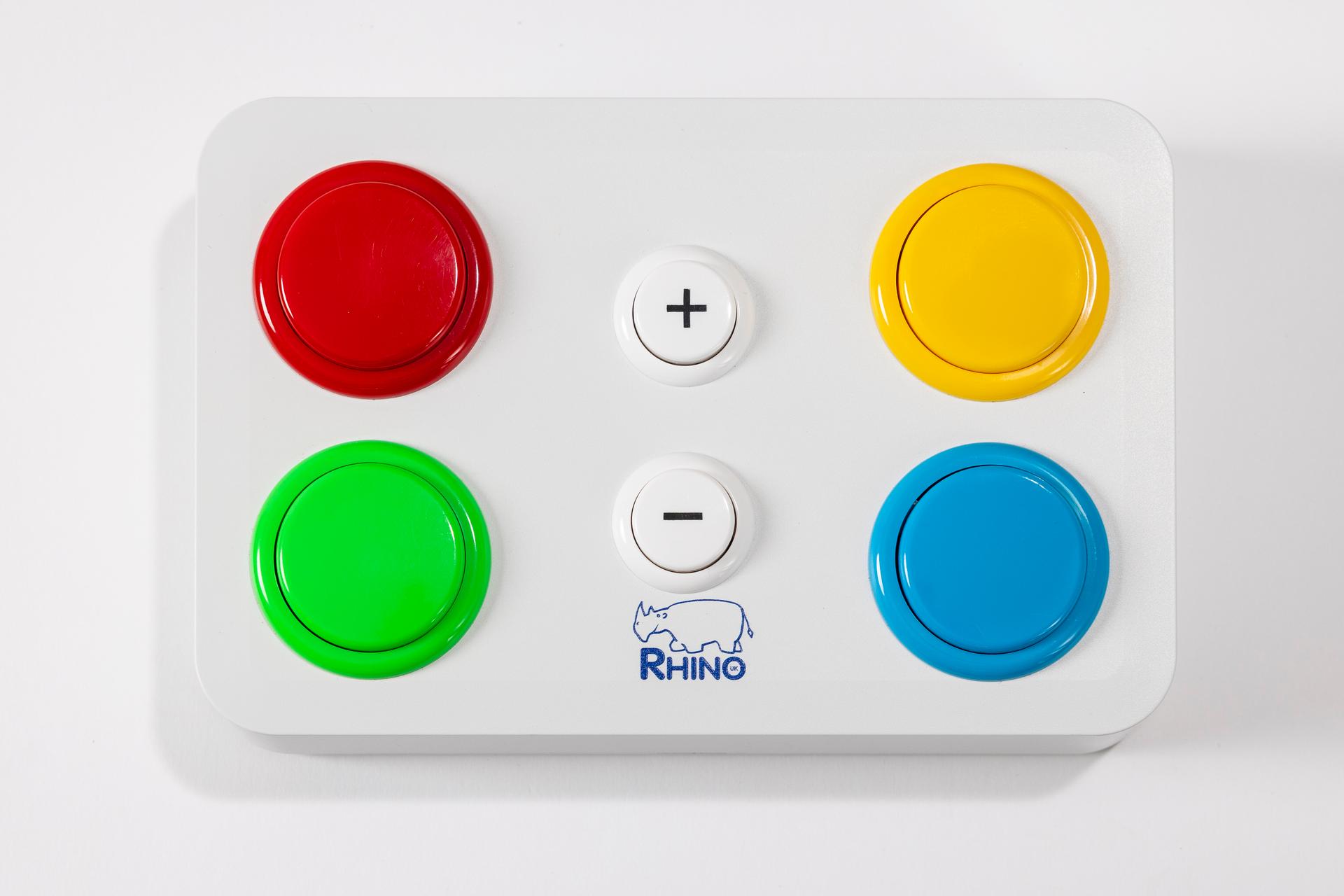 White remote control with four large buttons that are red, yellow, green and blue.