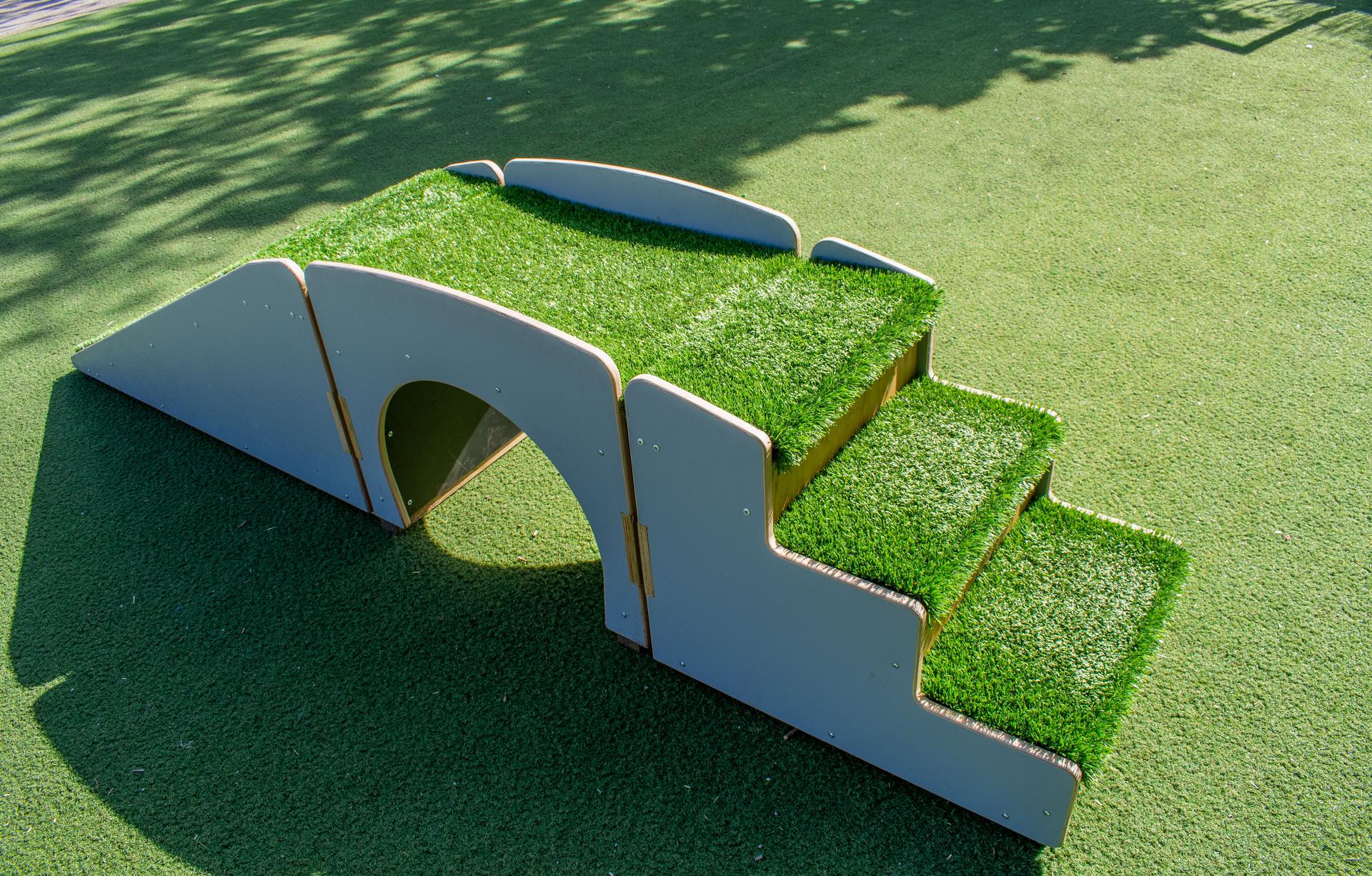 grass steps alone in a playground setting