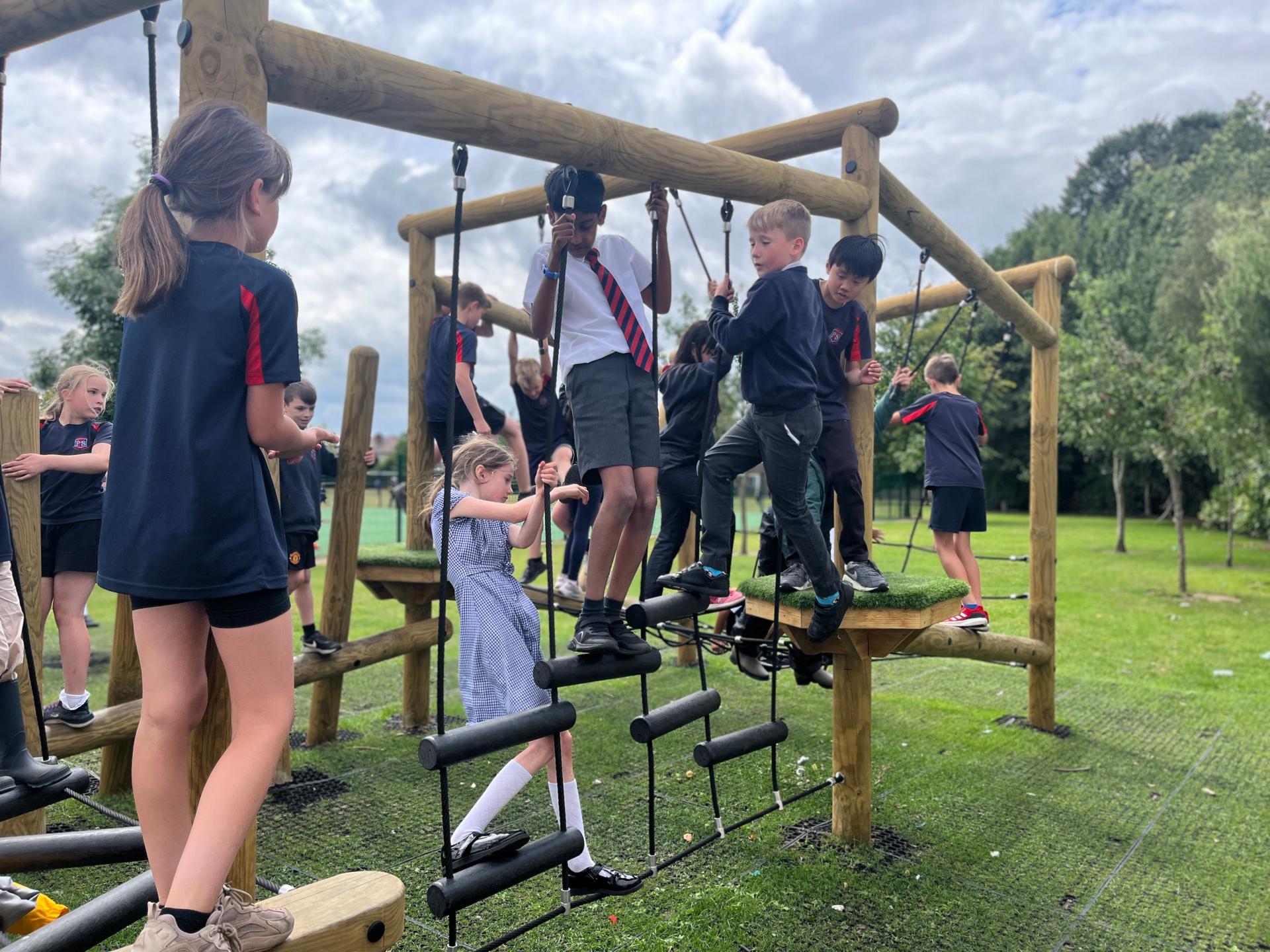 A group of children climbing on the Delamere Forest Circuit