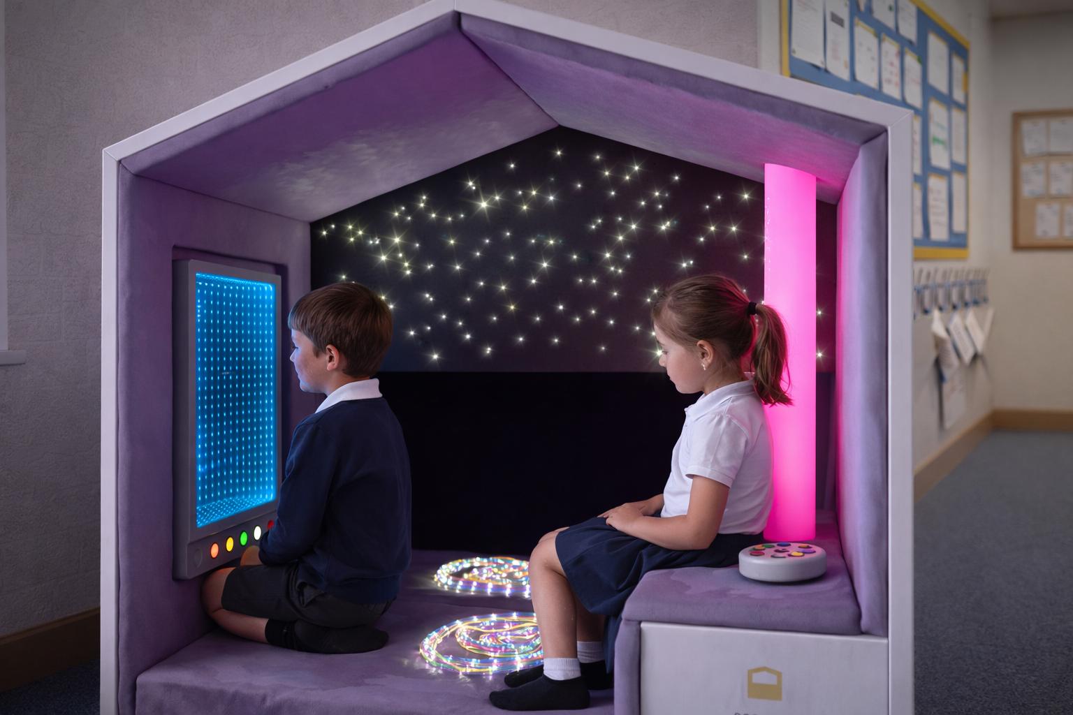 Two children are playing within the Inclusive Access Sensory Nook.