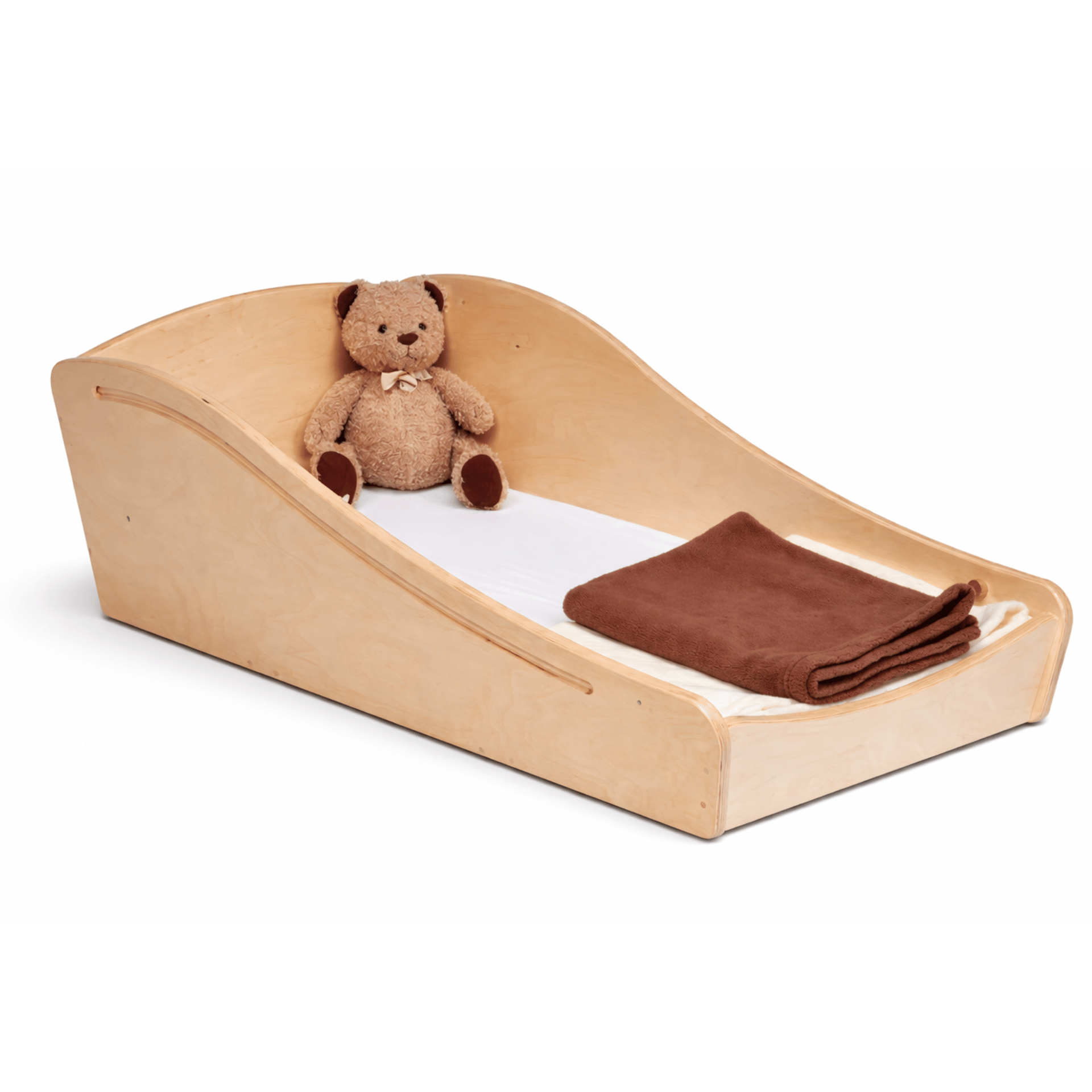 An empty wooden sleeping pod for babies and toddlers with a brown blanket and teddy.