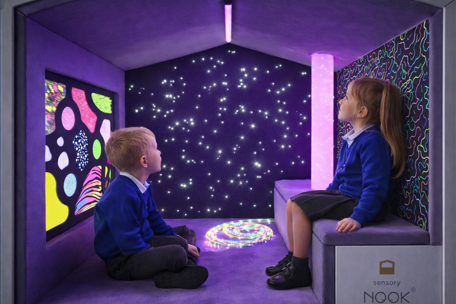 Two children are looking around the inside of the Sensory Nook Glow, engaged with the lighting.