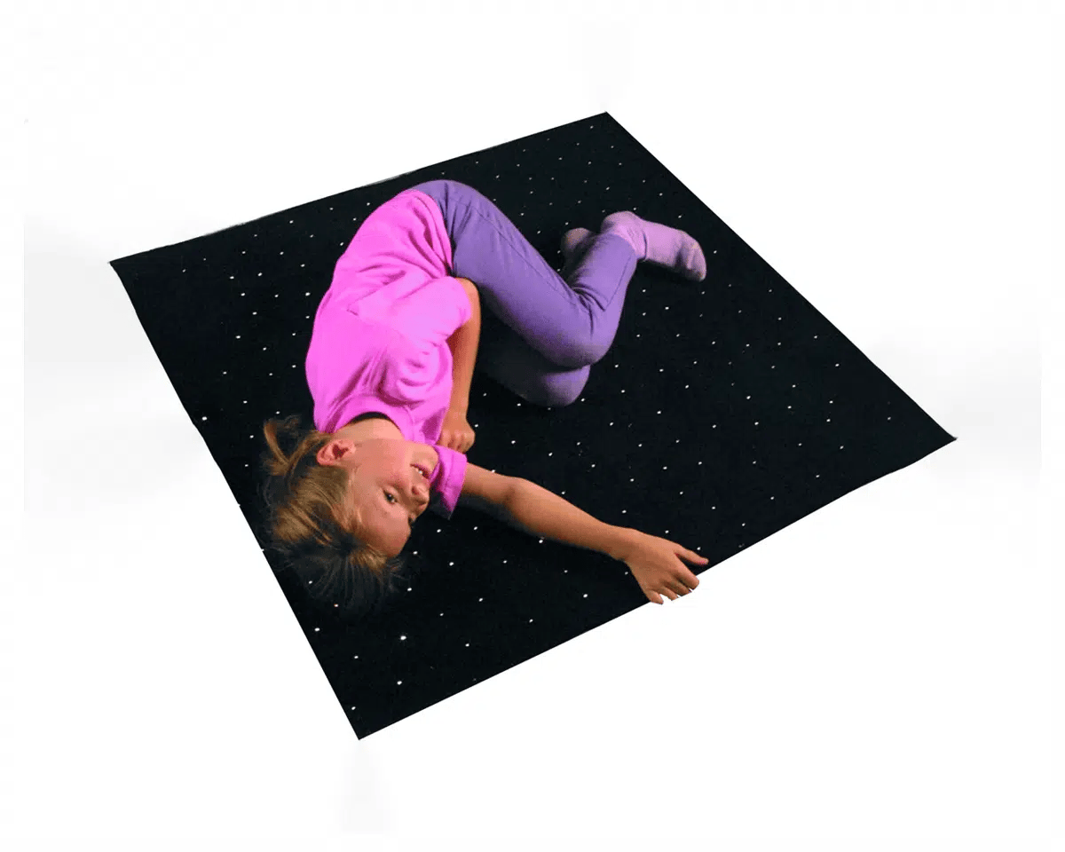girl on fibre optic sensory carpet
