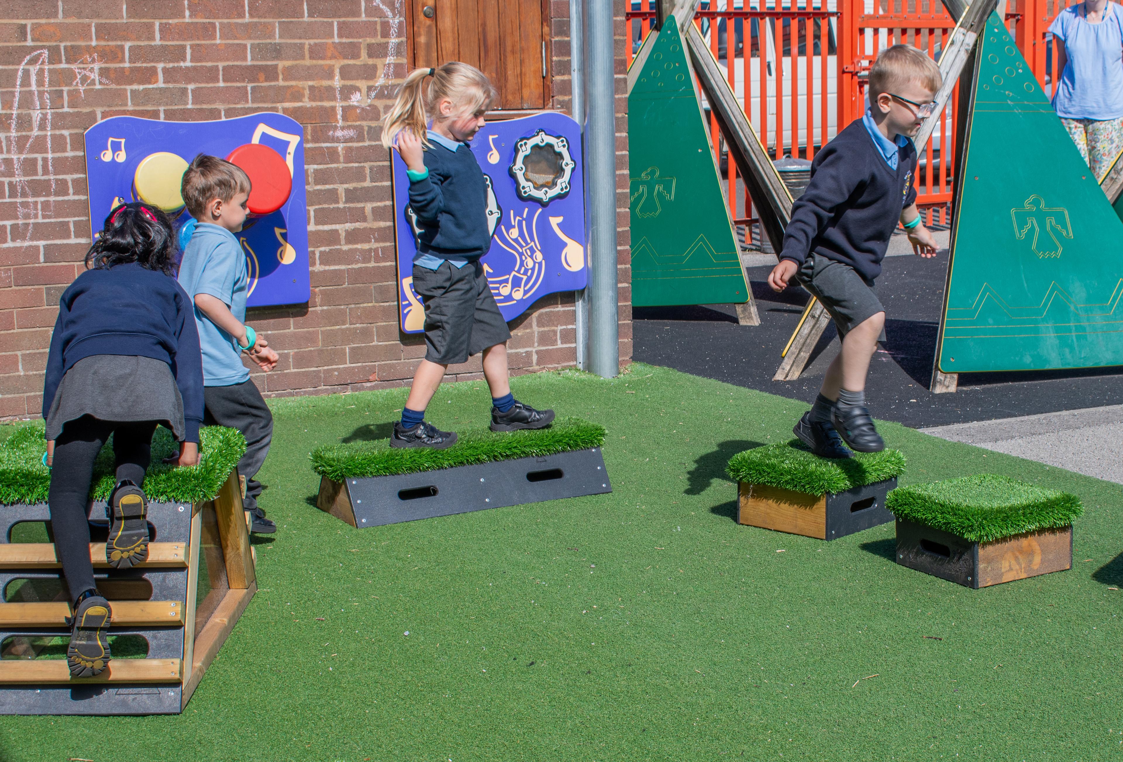 Children walking over blocks that are part of the Sports Premium Explorer Package
