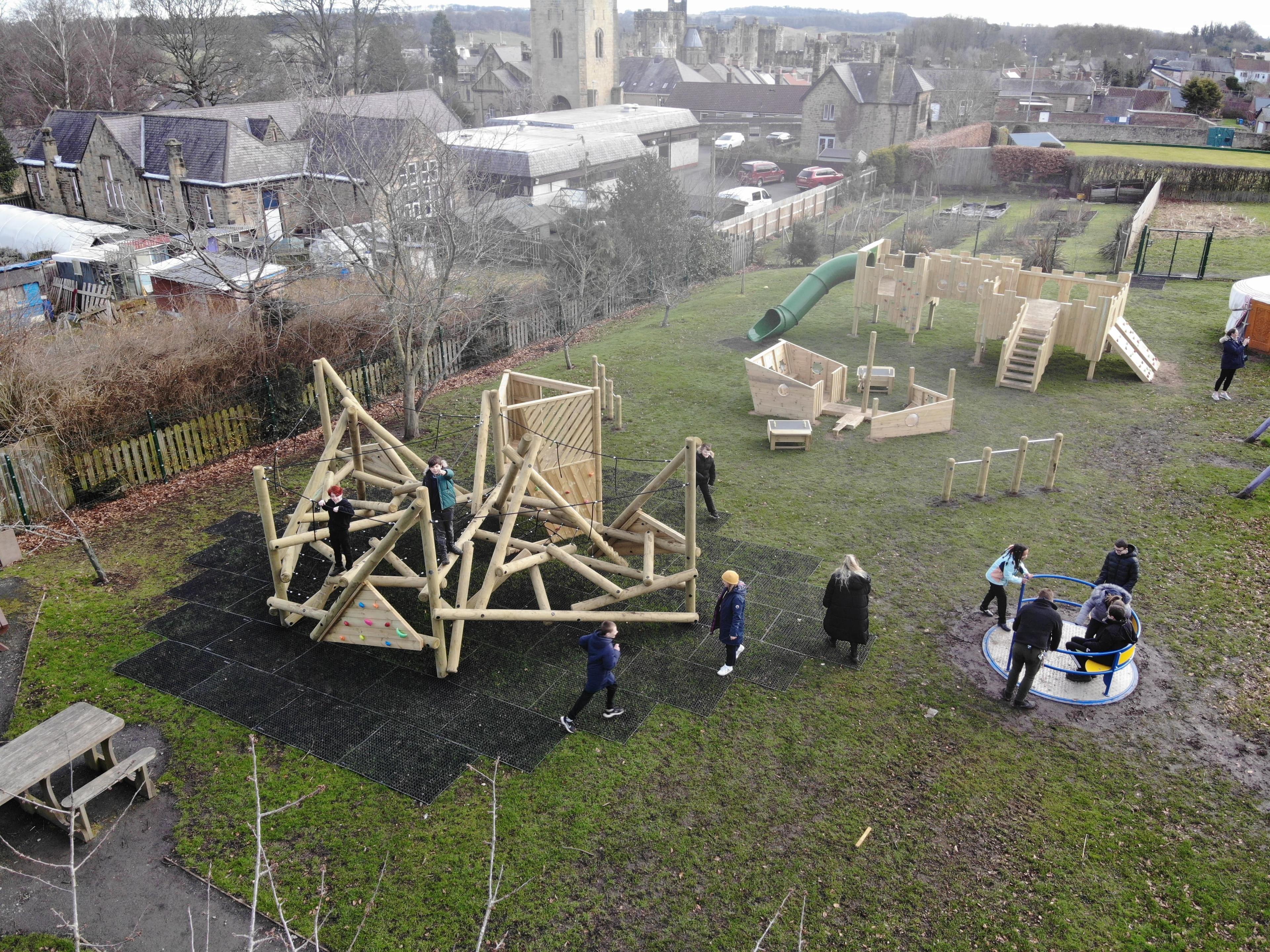Crinkle Crags Climber with Platform and Fireman's Pole installed on school field.