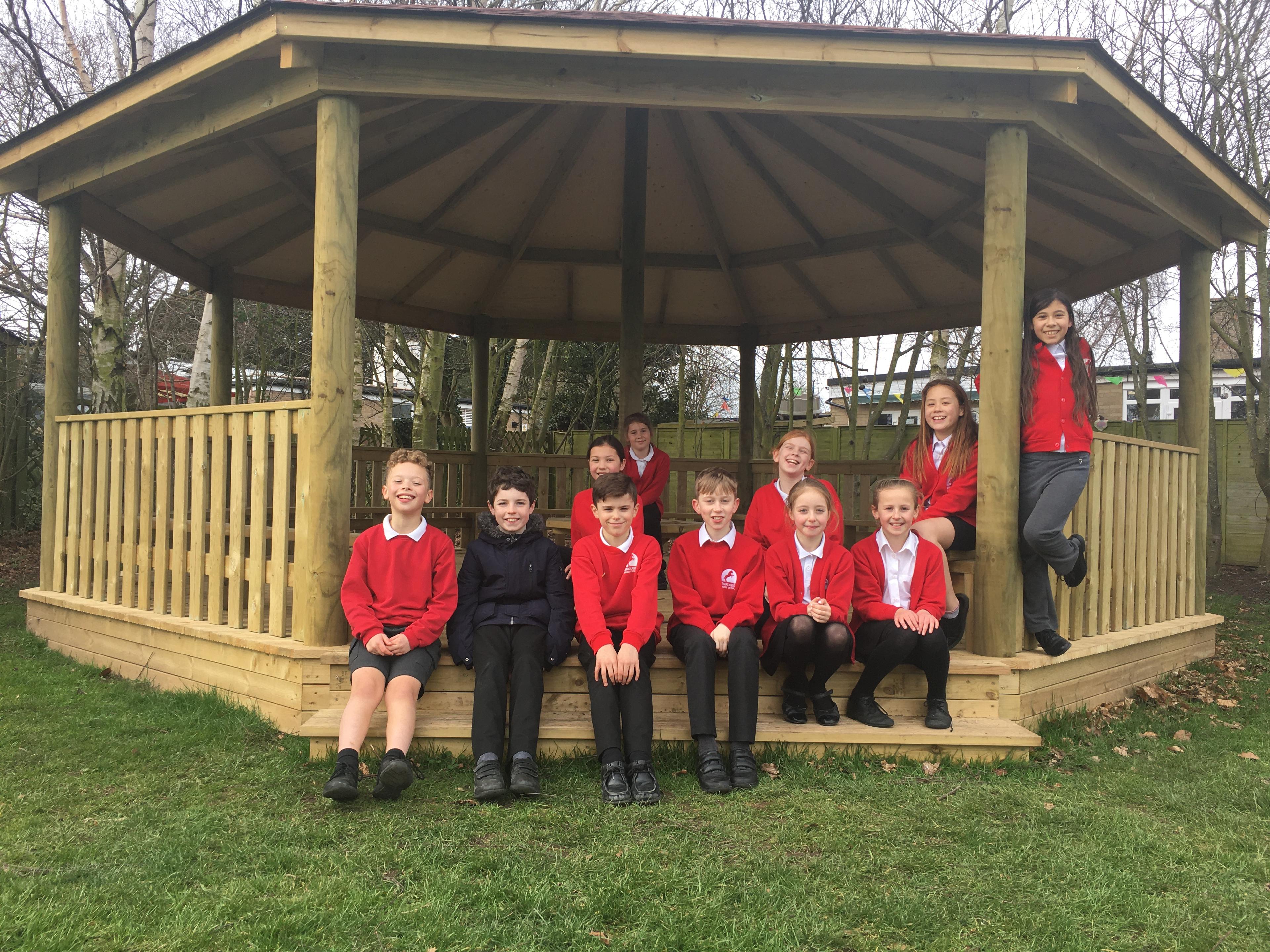 7.5m wooden gazebo in a school playground.