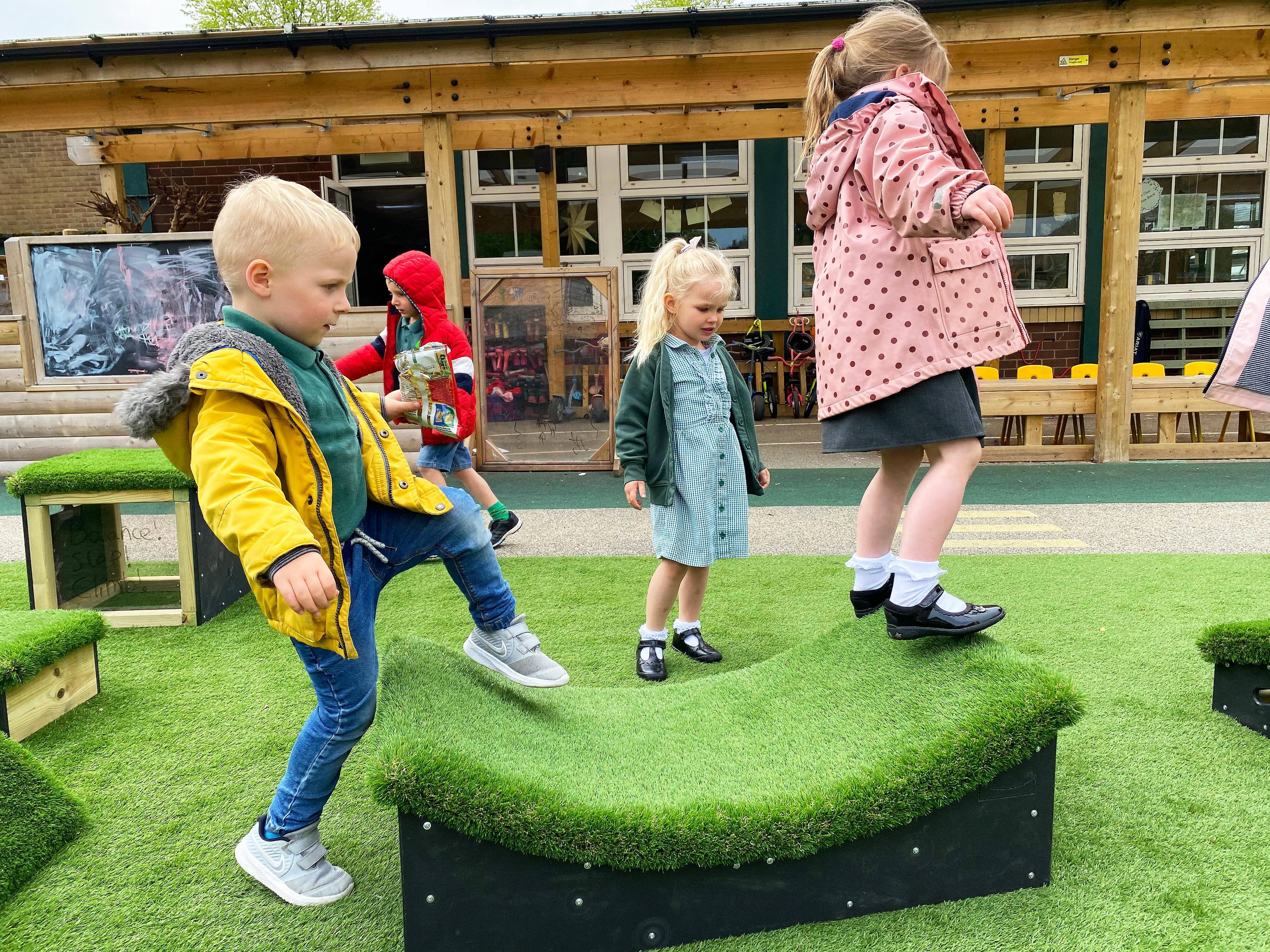 2 children playing on a block together
