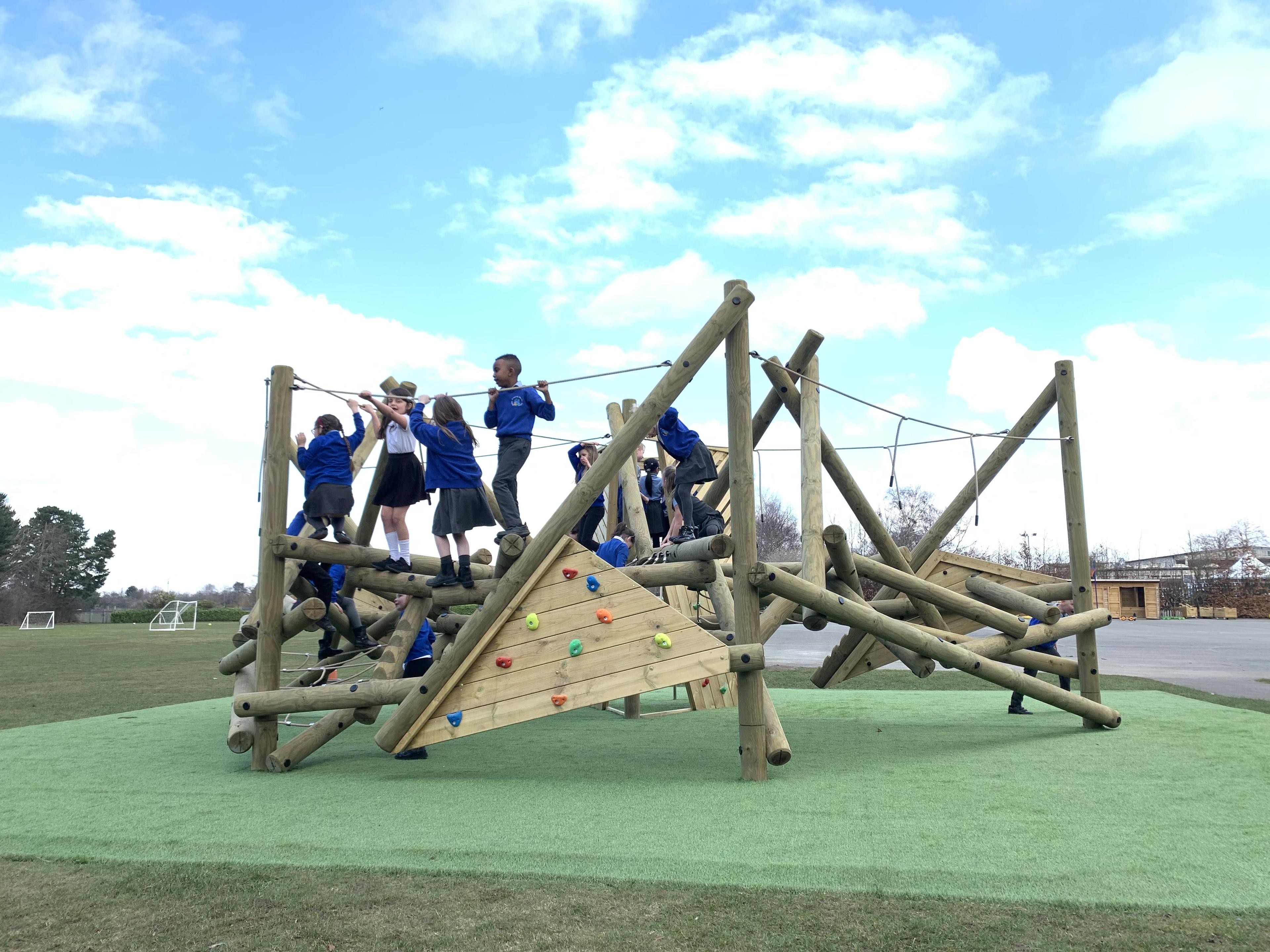 Primary school children climbing on the Crinkle Crags Climber with Platform and Climbing Net.