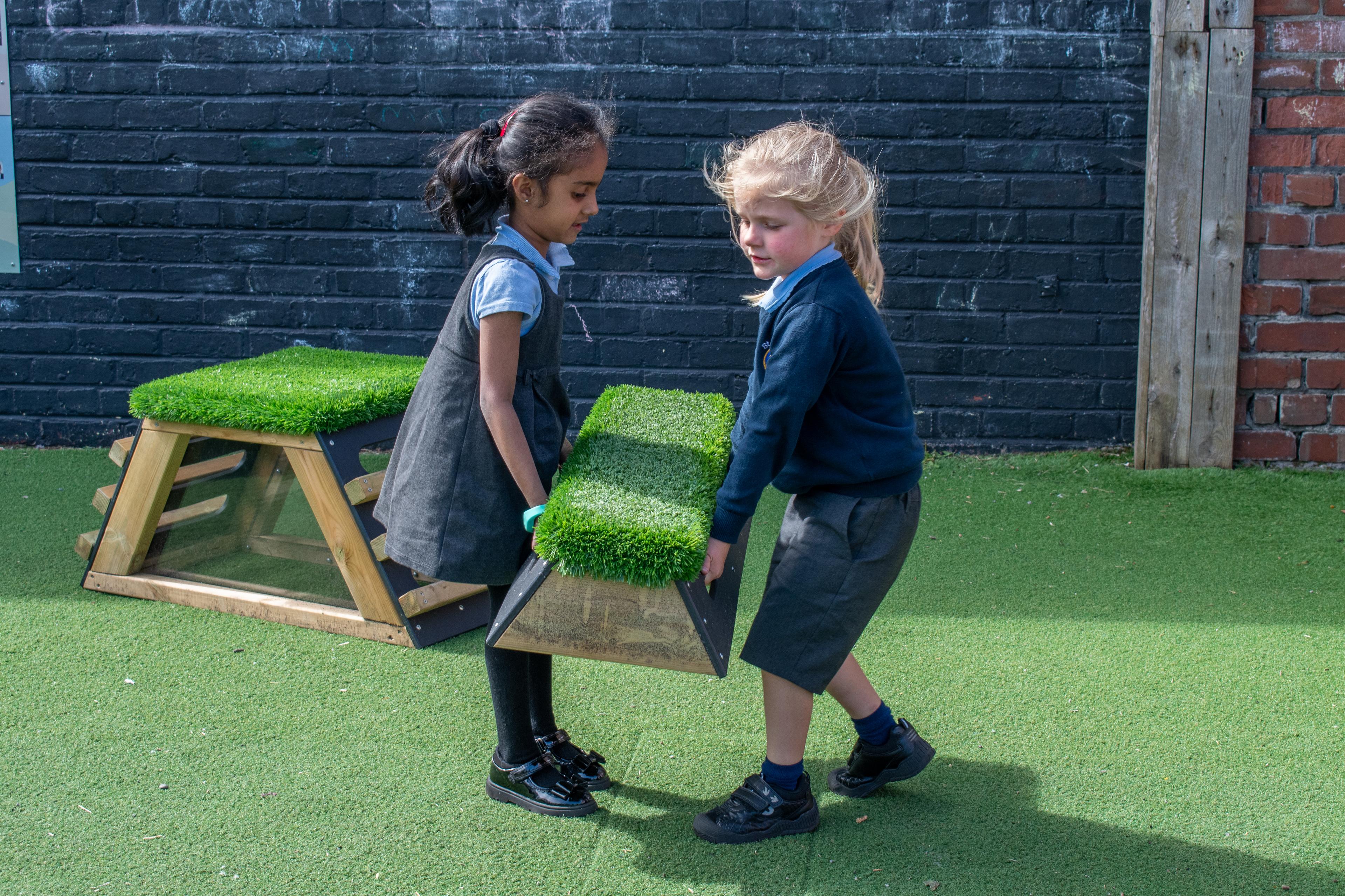 School children playing with grass-topped Get Set, Go! Blocks - The Mendips Set.