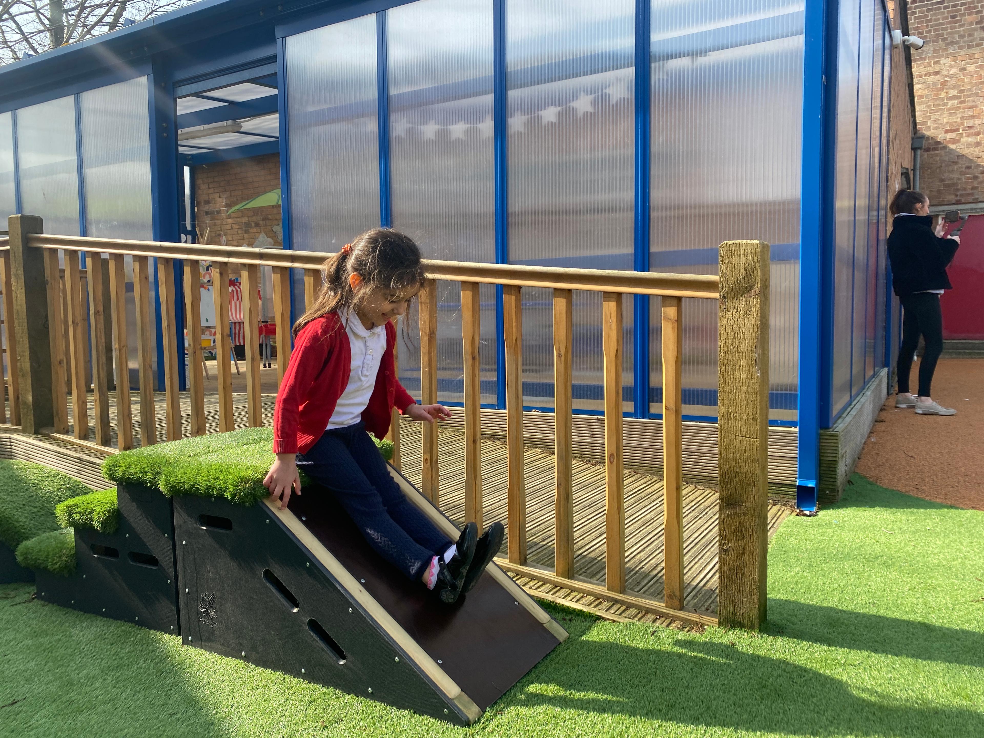 A child sliding down one of the get set go blocks