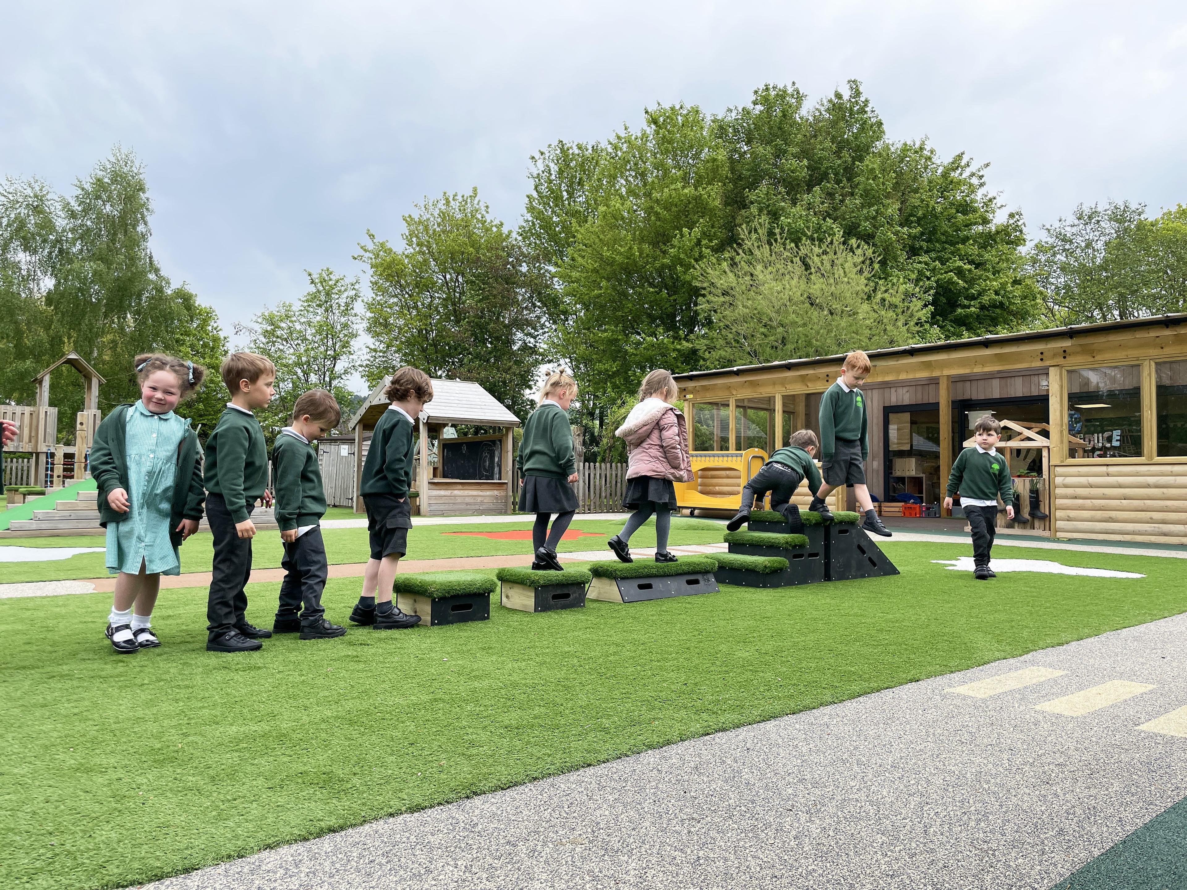Group of children are tackling obstacle course made from the Chilterns Get Set Go Blocks