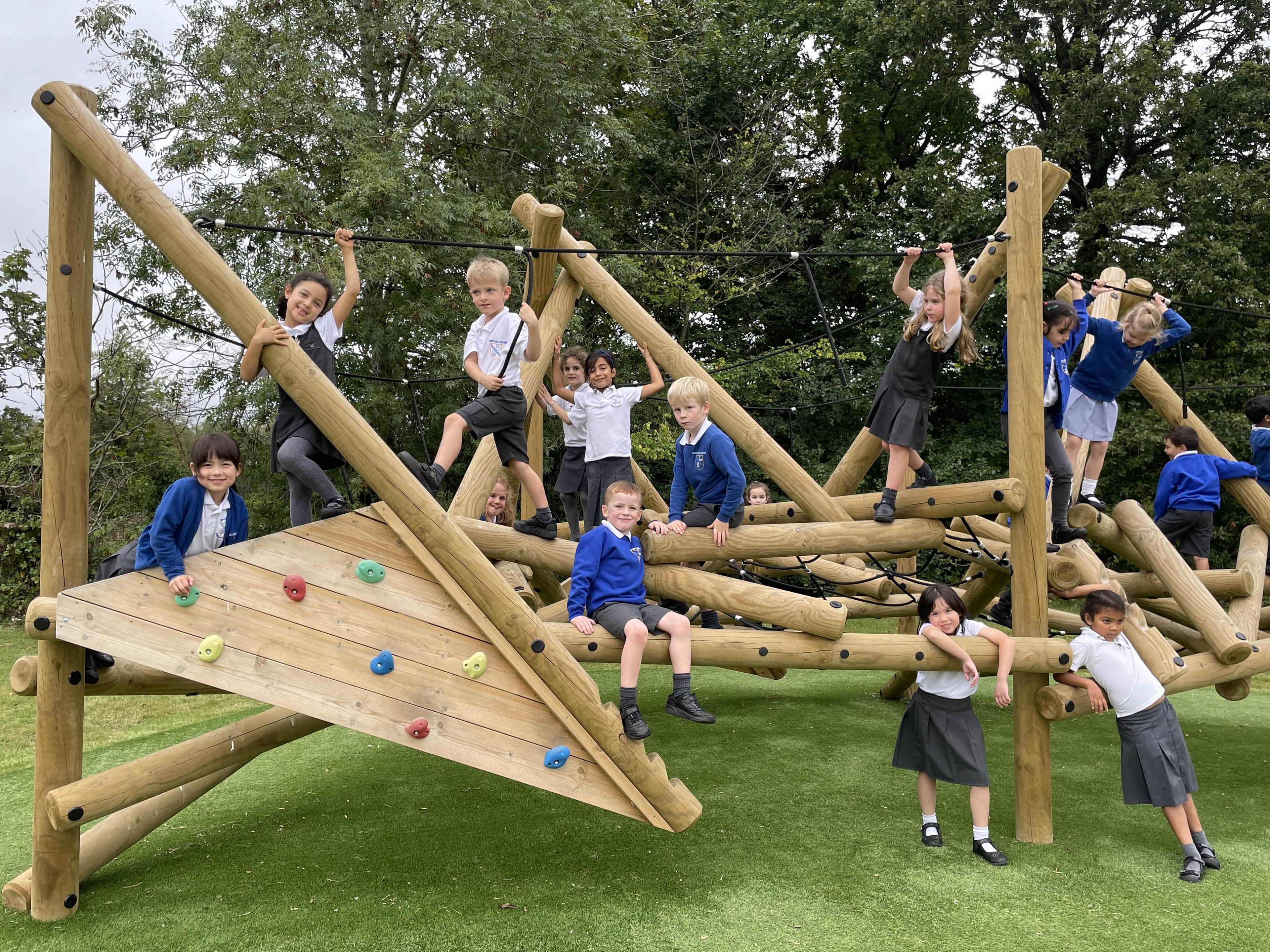 Primary school children posing on the Crinkle Crags Climber with Platform and Climbing Net.