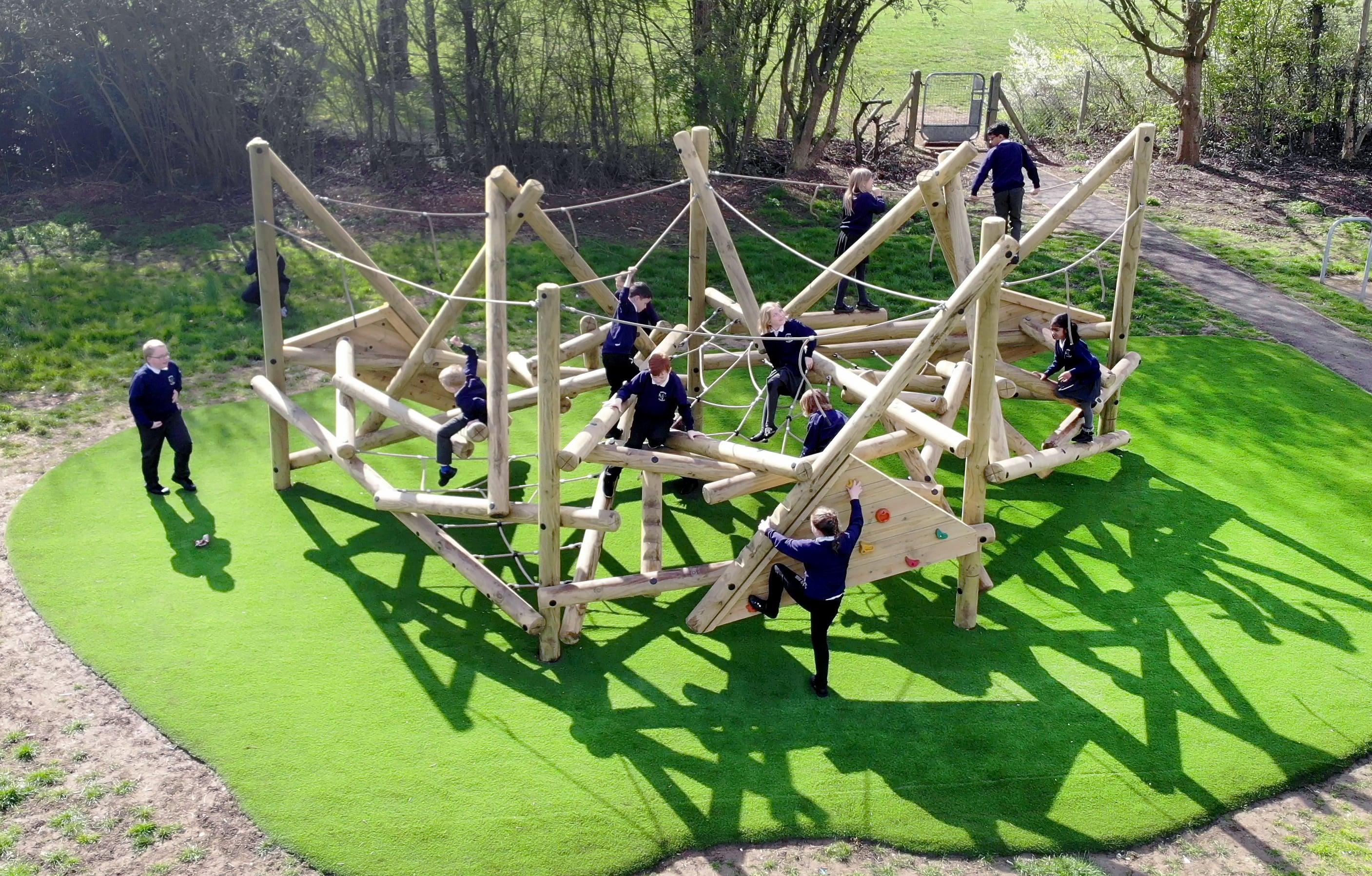KS2 children exploring the Crinkle Crags Climber with Platform and Climbing Net.