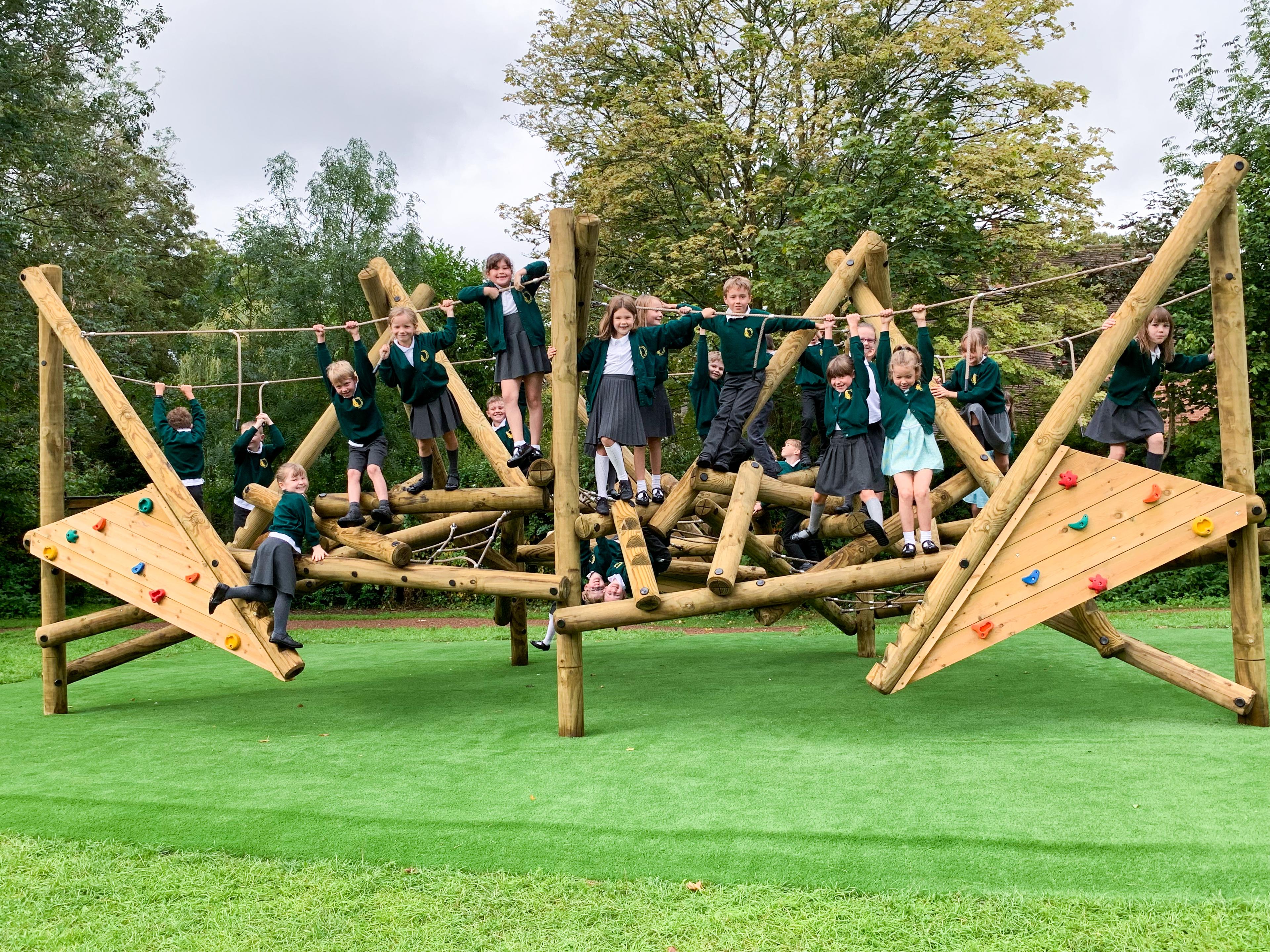 Wooden Crinkle Crags climbing frame in a school playground.