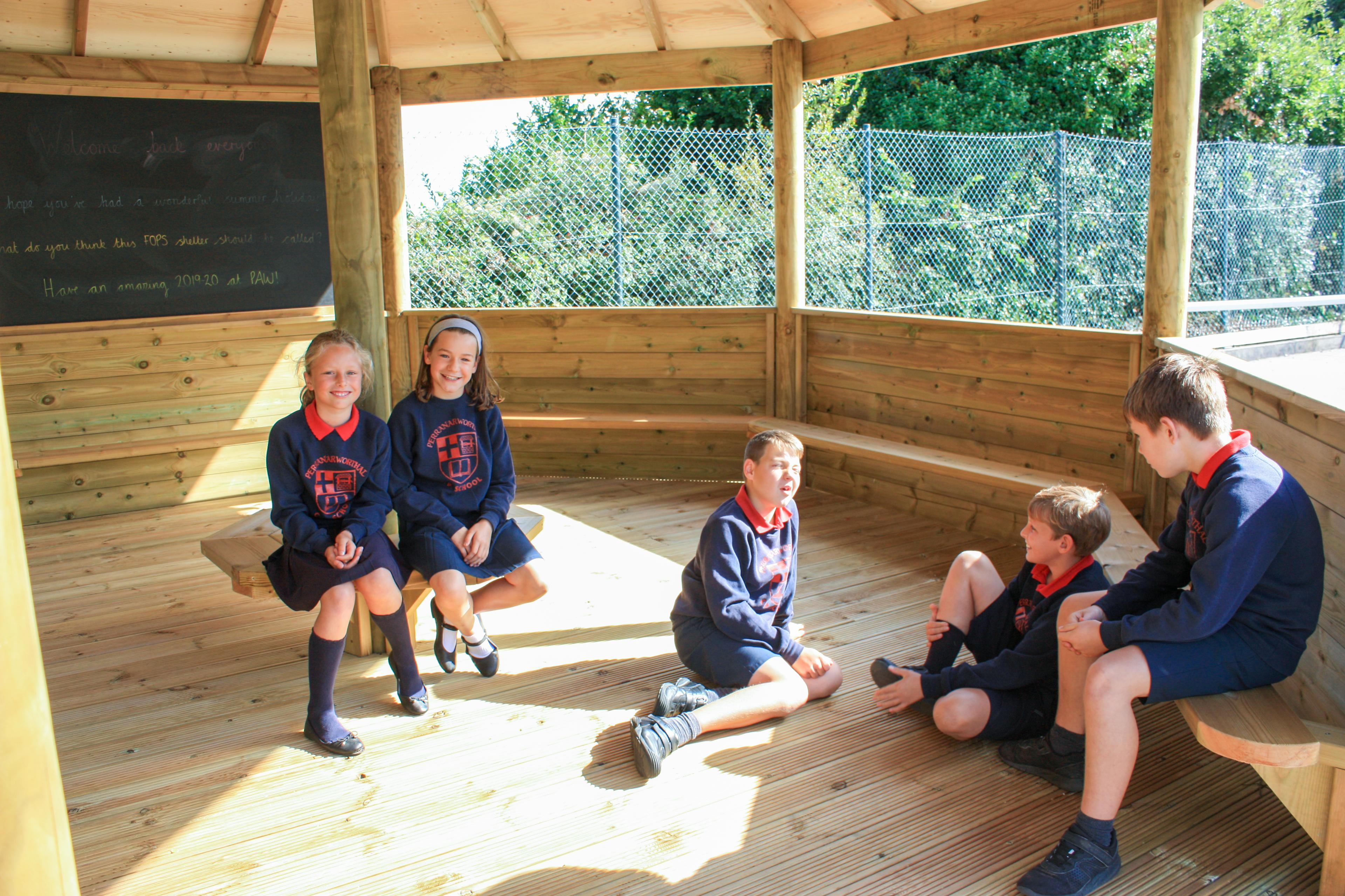 Wooden 6m Octagonal Gazebo with decked base in a school playground.