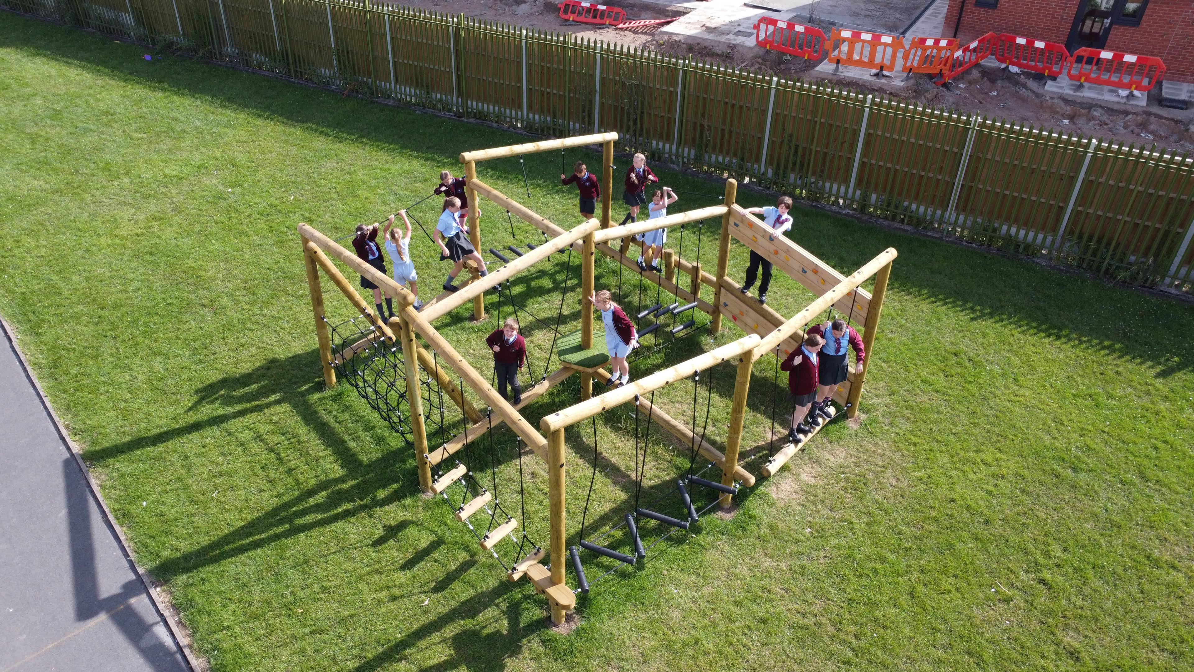 An ariel view of an open ended climbing frame in a school playground