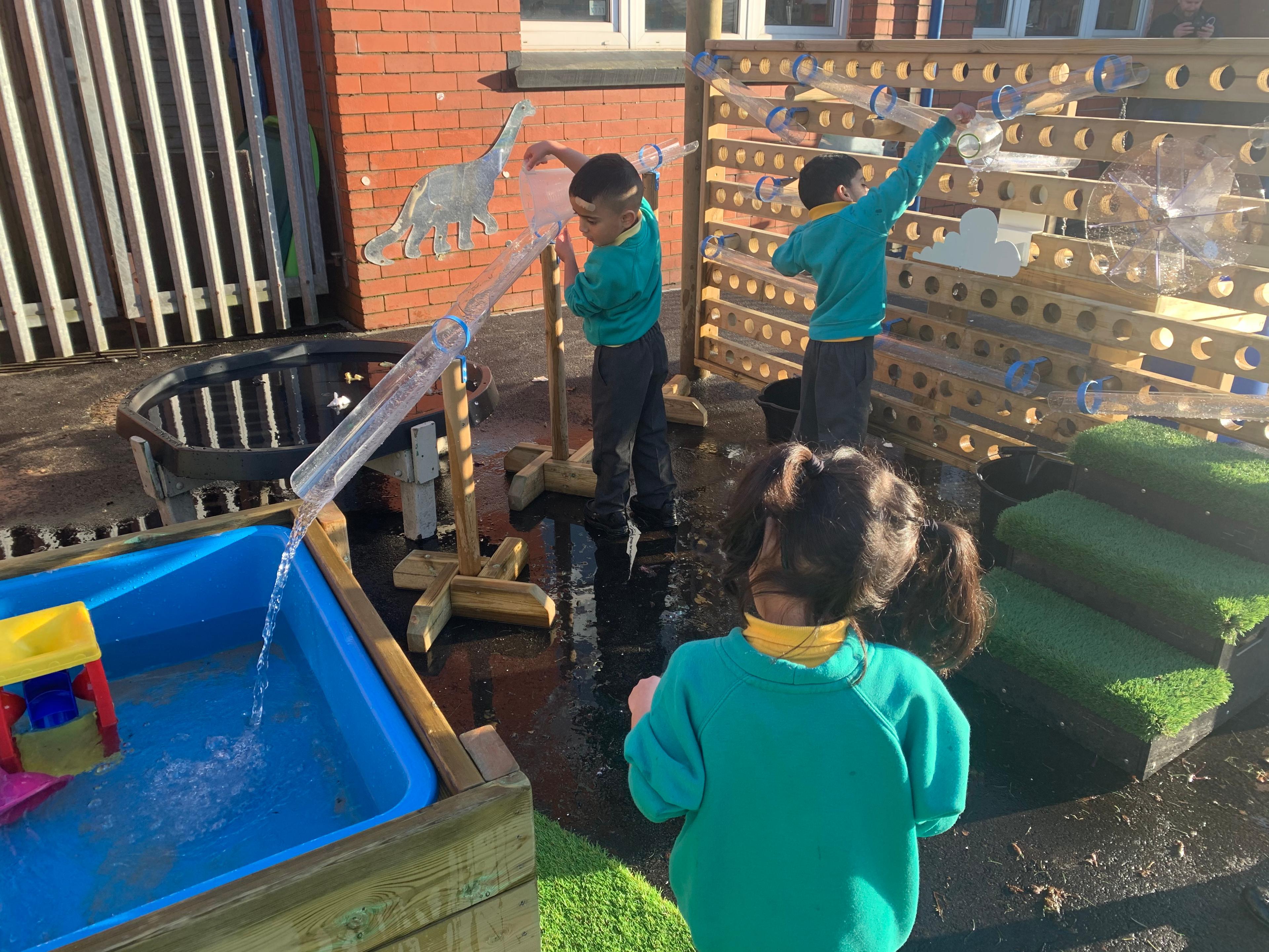 EYFS children playing with the Water Wall with Water Play Package