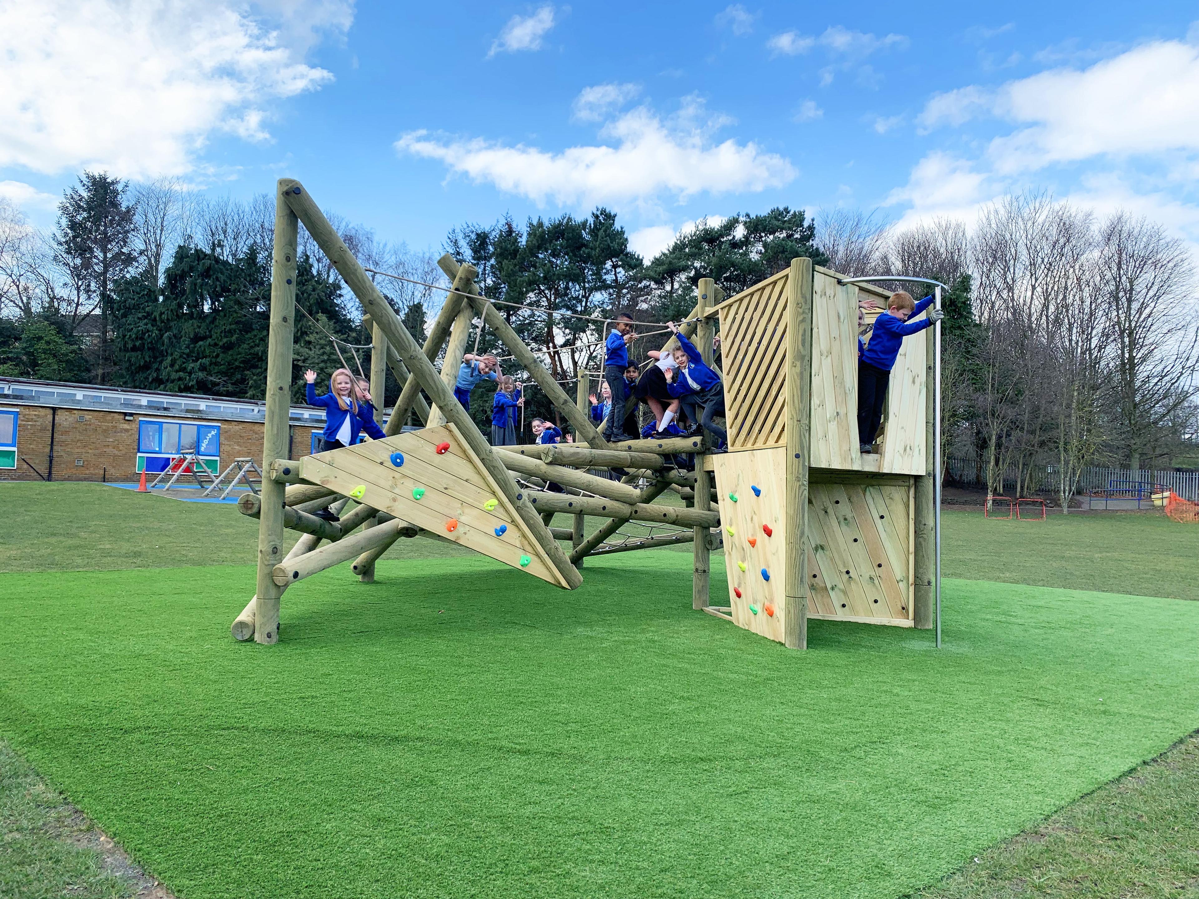 The Crinkle Crags Climber with Platform and Fireman's Pole with a large group of children exploring it.