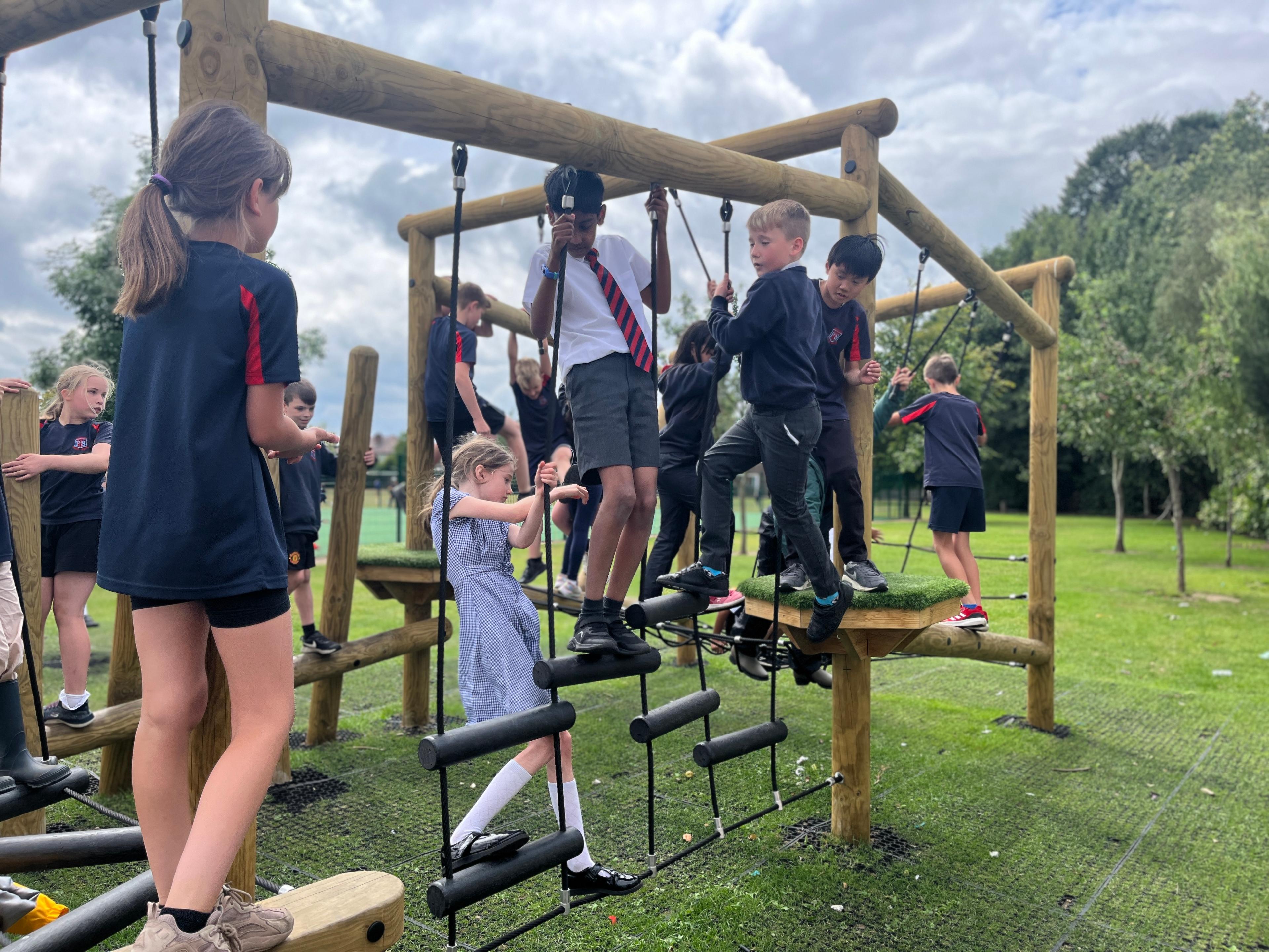 A group of children climbing on the Delamere Forest Circuit