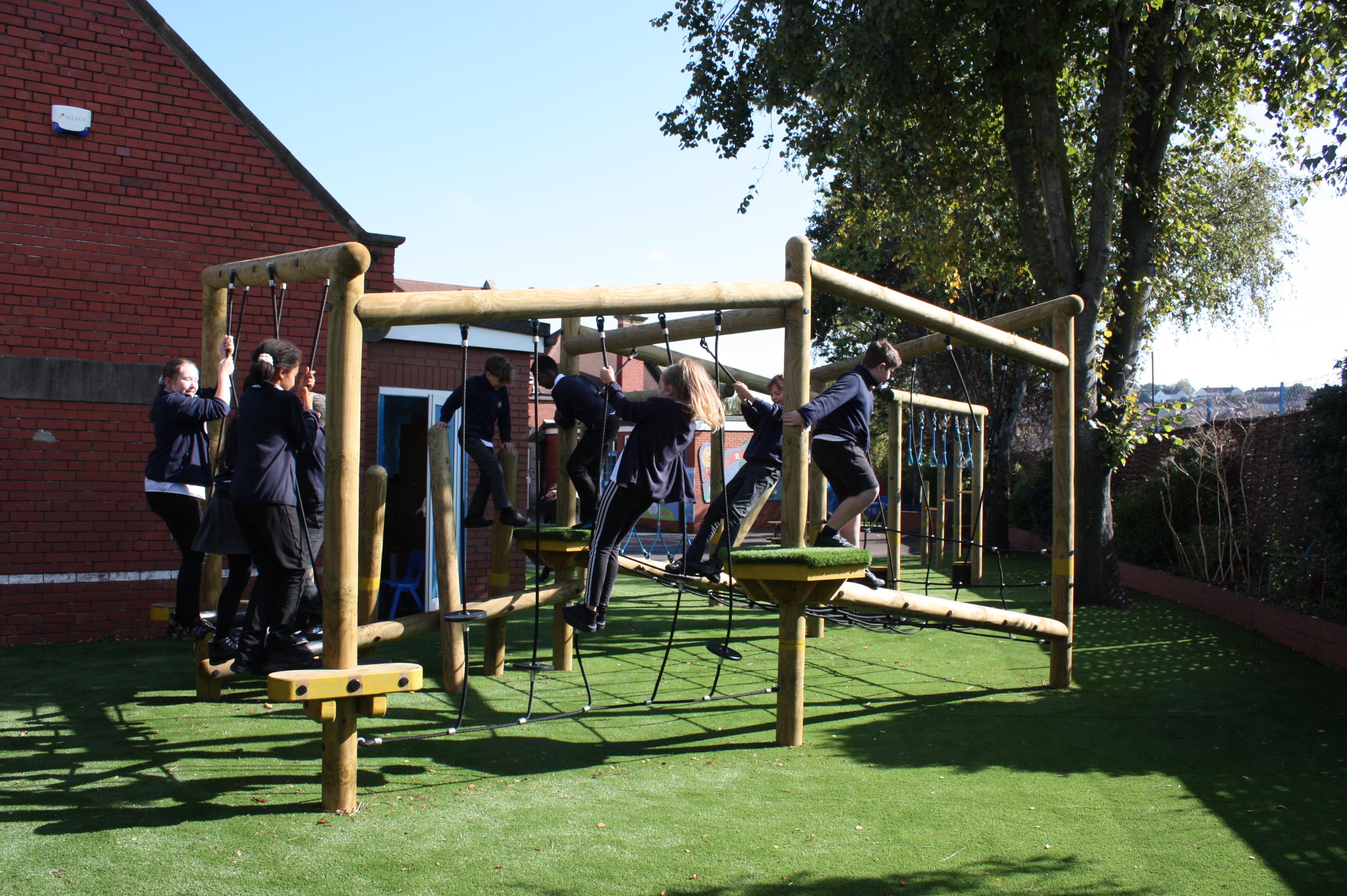 A group of children climbing on the Delamere Forest Circuit