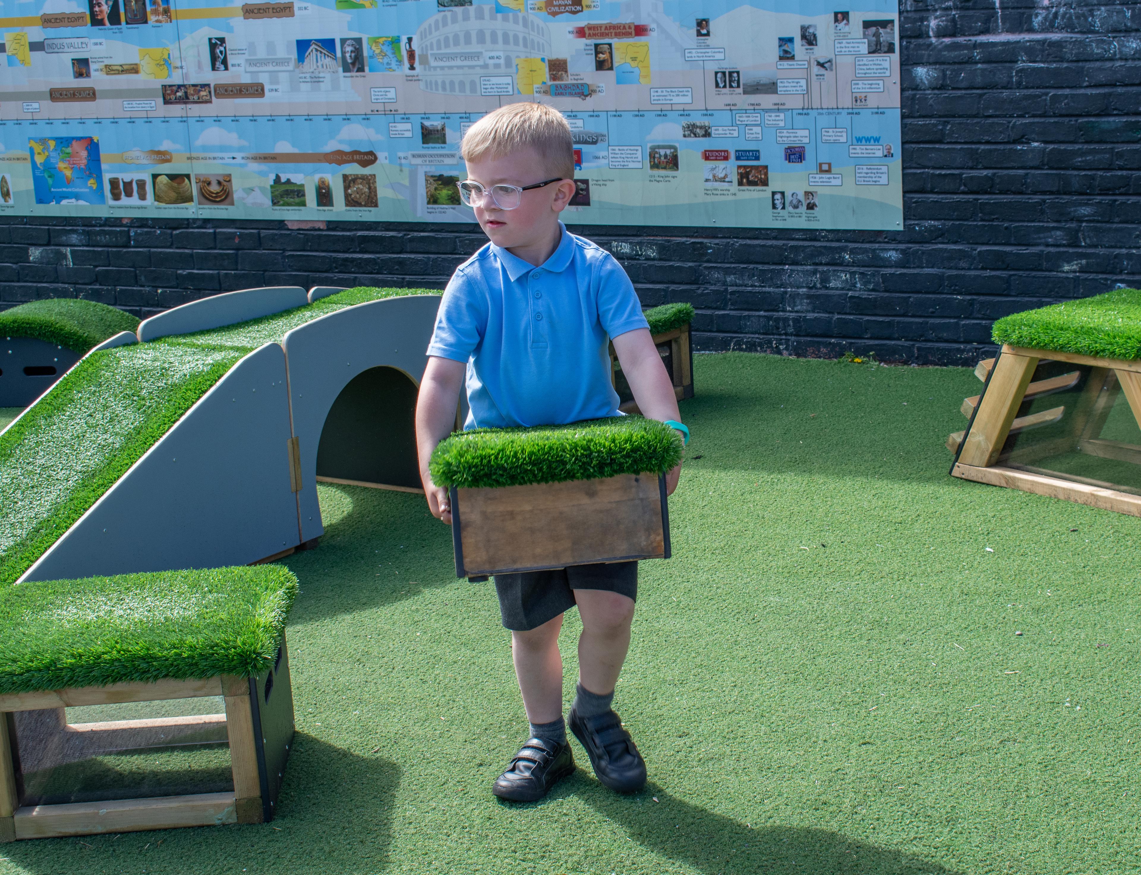 School children playing with grass-topped Get Set, Go! Blocks - The Mendips Set.