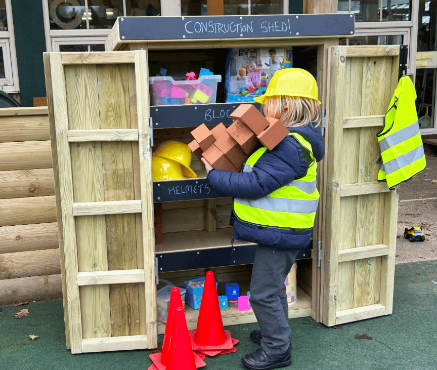 A Pentagon Play bespoke School Playground Scheme with children playing on the playground
