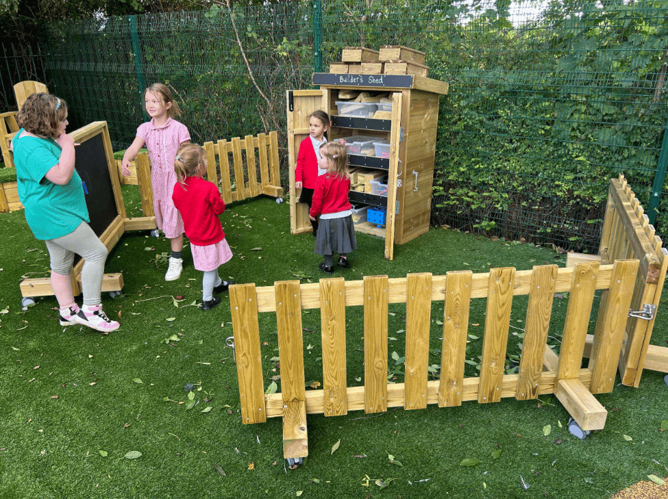 A Pentagon Play bespoke School Playground Scheme with children playing on the playground