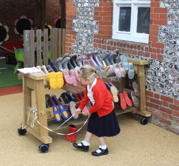 A Pentagon Play bespoke School Playground Scheme with children playing on the playground