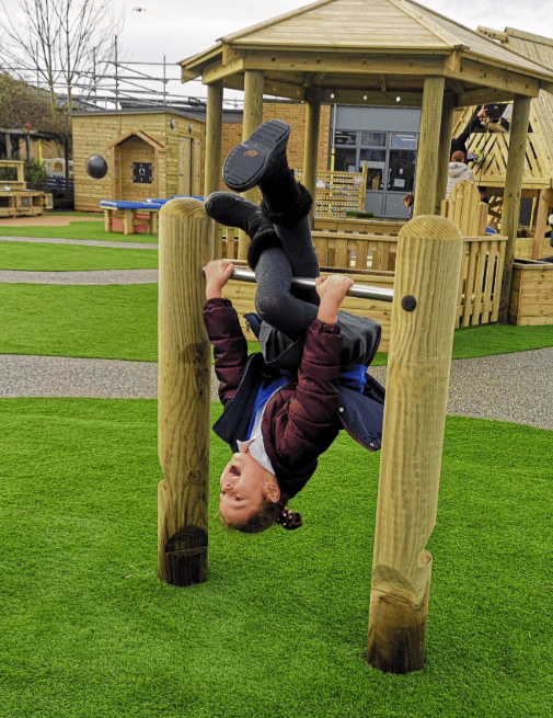 A Pentagon Play bespoke School Playground Scheme with children playing on the playground