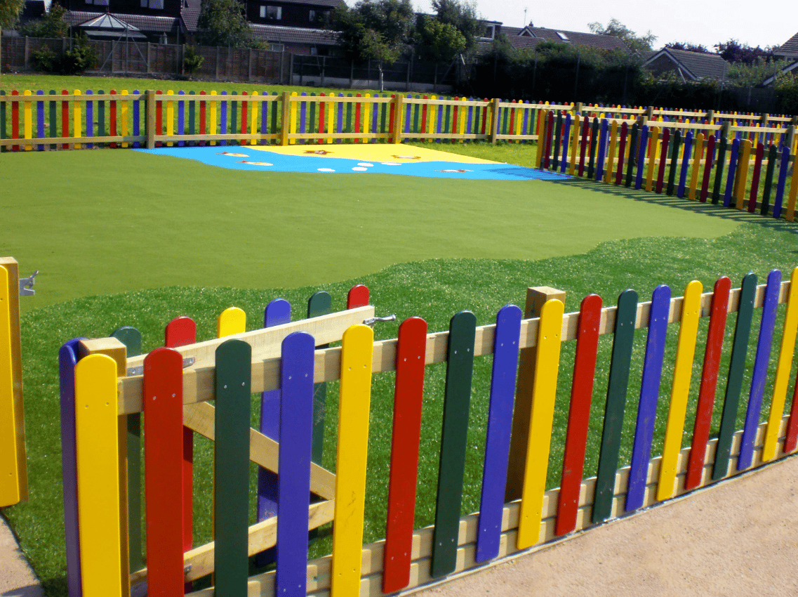 A Pentagon Play bespoke School Playground Scheme with children playing on the playground