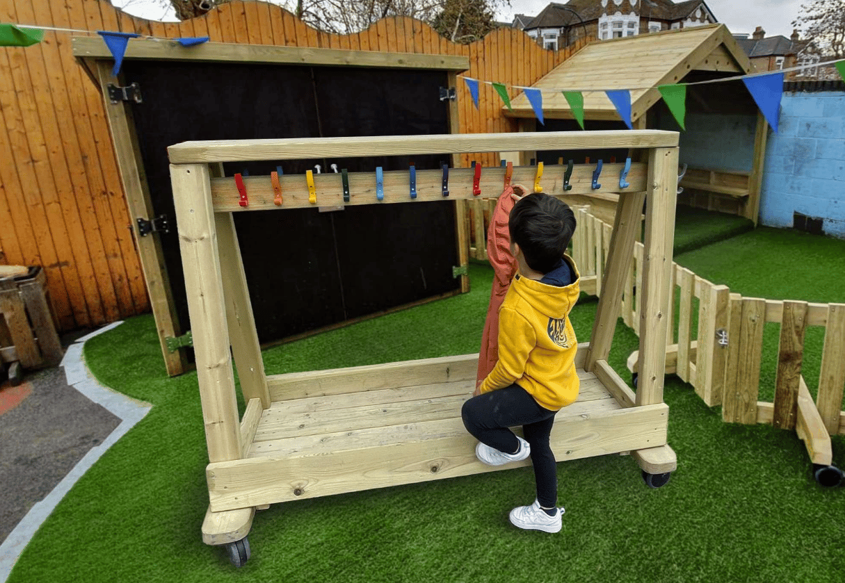A Pentagon Play bespoke School Playground Scheme with children playing on the playground
