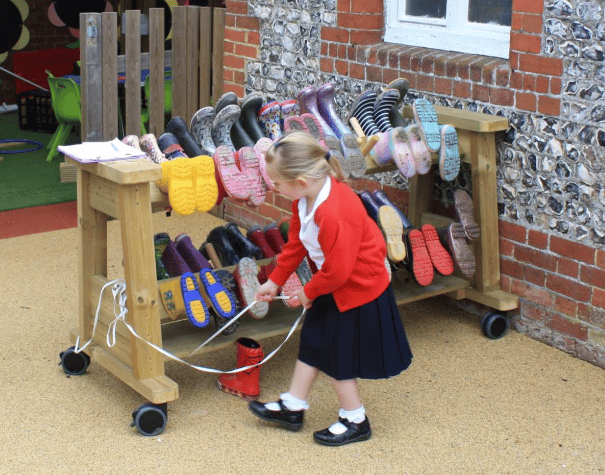 A Pentagon Play bespoke School Playground Scheme with children playing on the playground