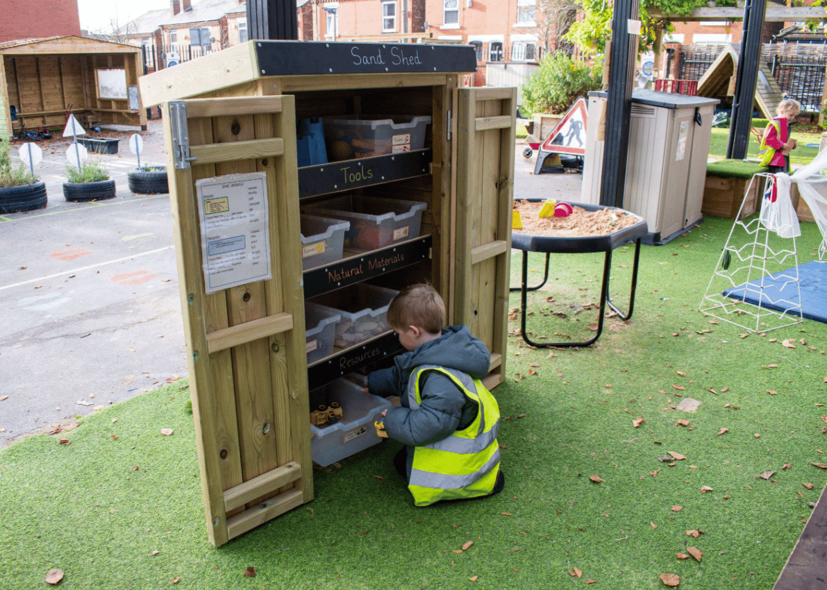 A Pentagon Play bespoke School Playground Scheme with children playing on the playground