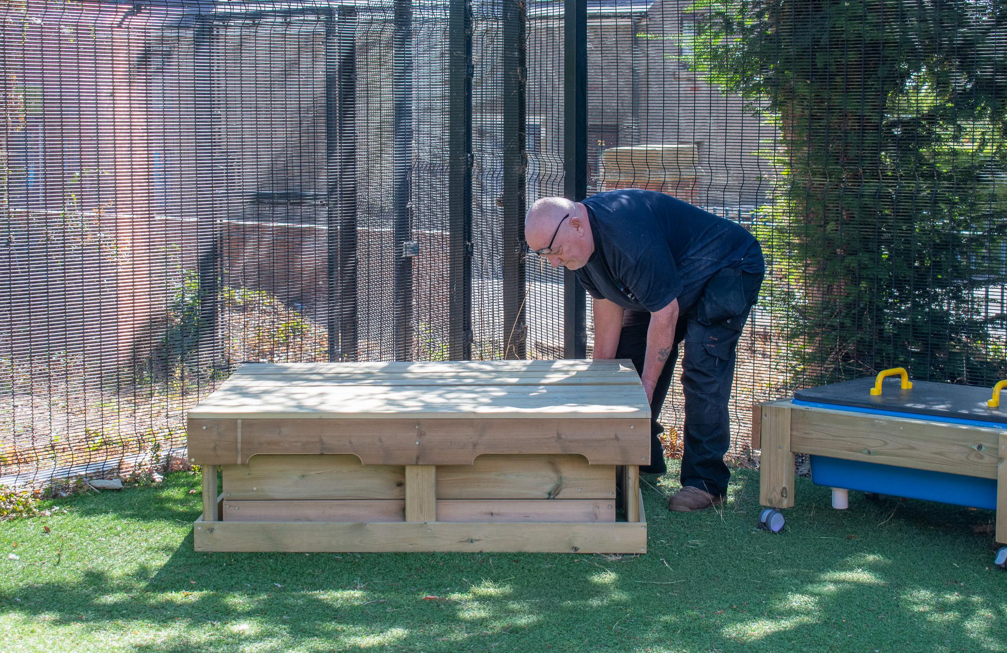 A Pentagon Play bespoke School Playground Scheme with children playing on the playground