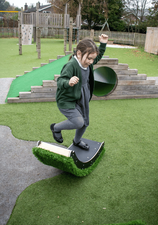 A Pentagon Play bespoke School Playground Scheme with children playing on the playground
