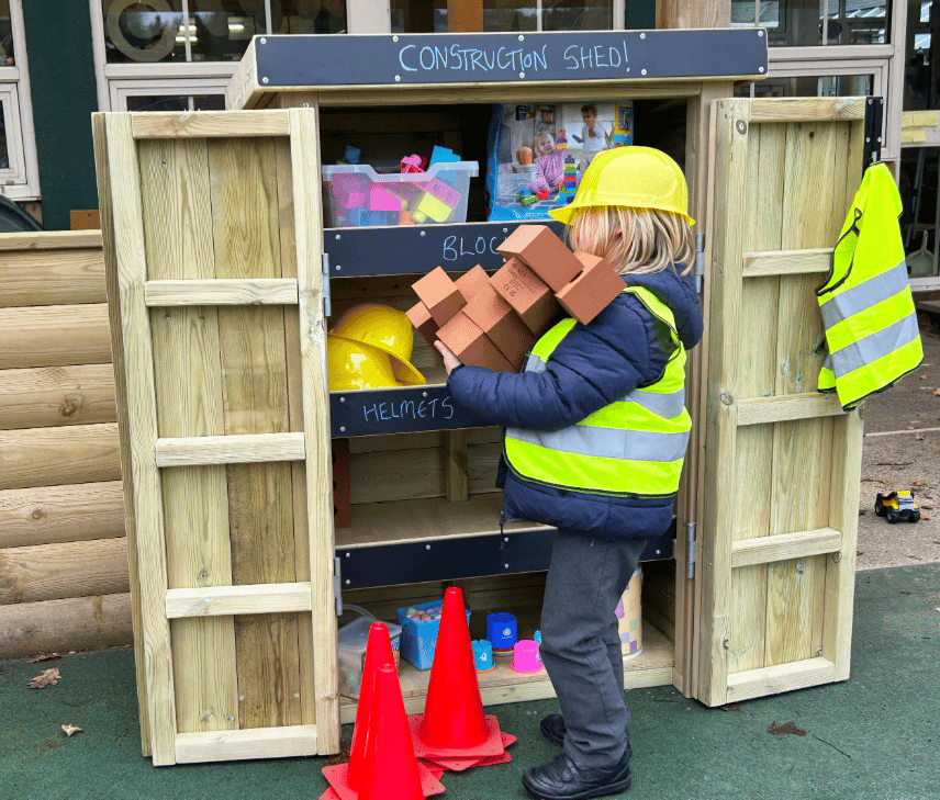 A Pentagon Play bespoke School Playground Scheme with children playing on the playground