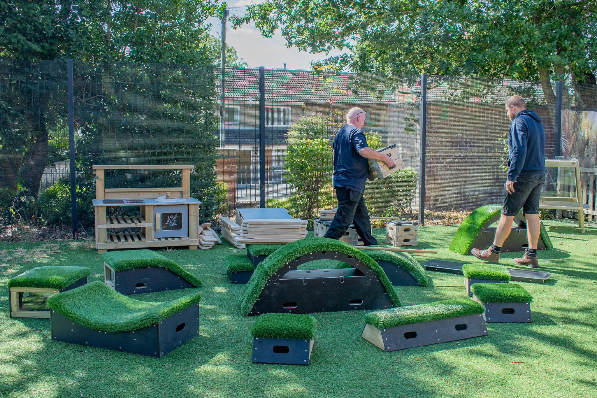 A Pentagon Play bespoke School Playground Scheme with children playing on the playground