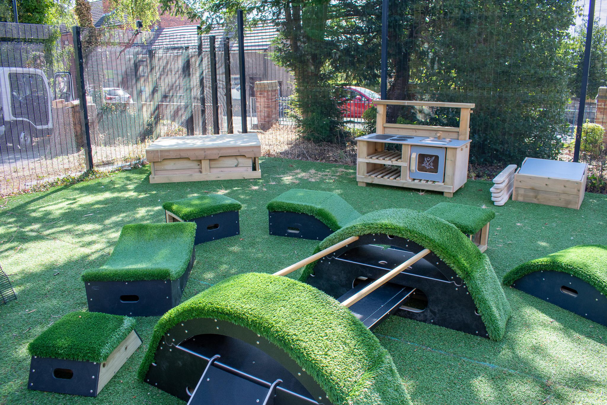 A Pentagon Play bespoke School Playground Scheme with children playing on the playground
