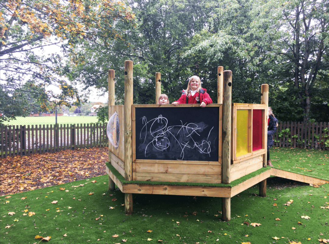 A Pentagon Play bespoke School Playground Scheme with children playing on the playground