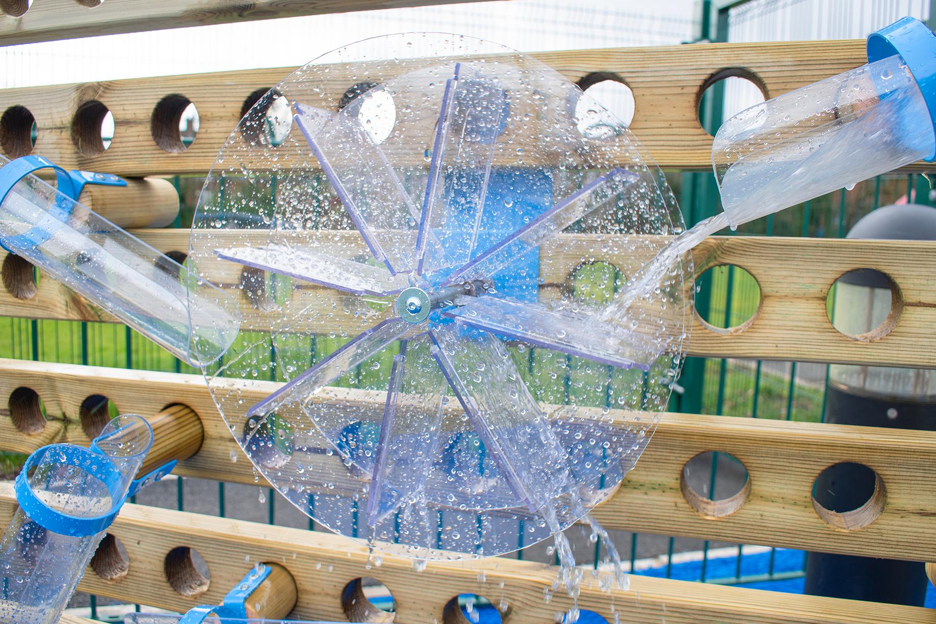 A Pentagon Play bespoke School Playground Scheme with children playing on the playground
