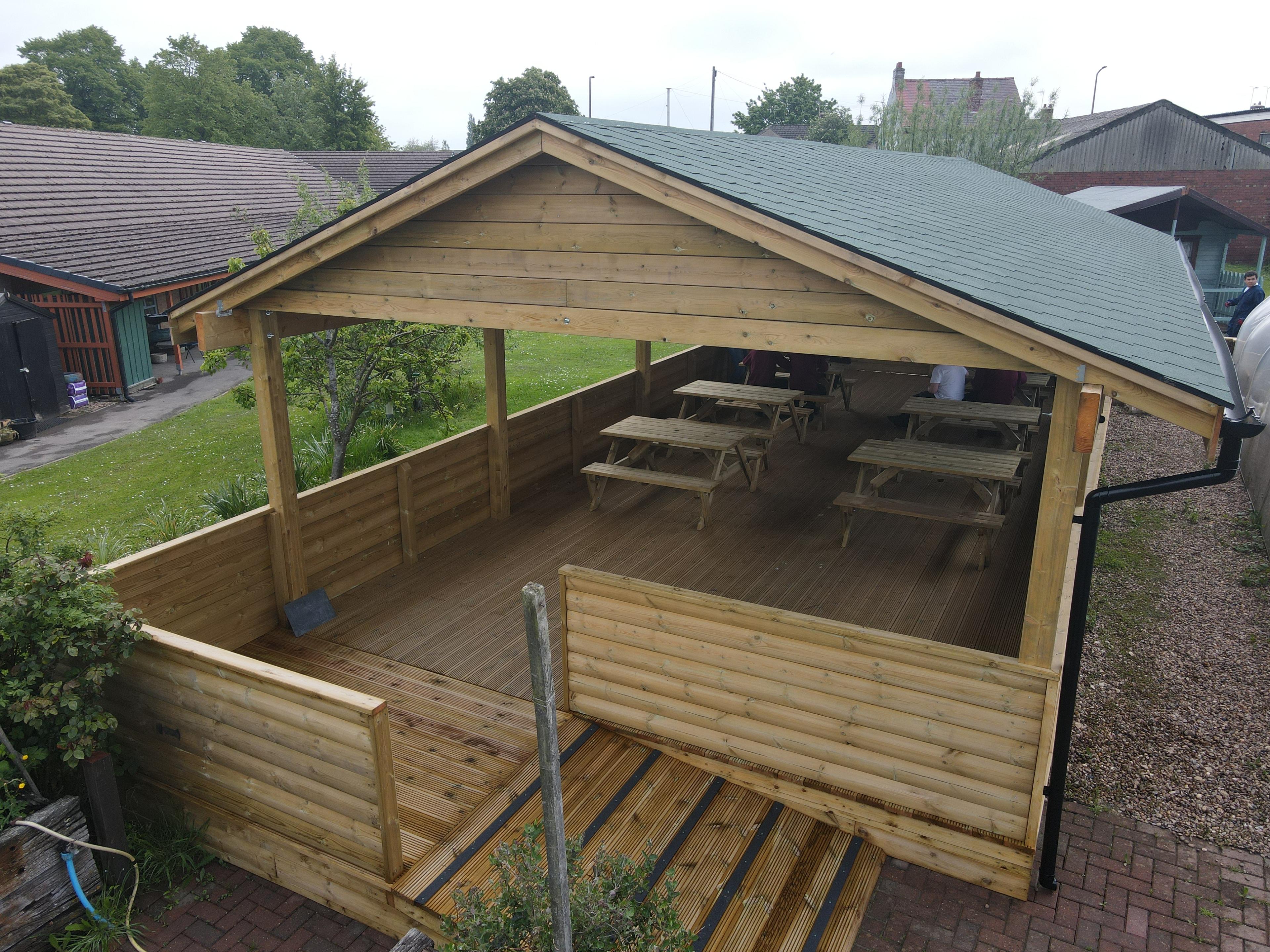 A Pentagon Play bespoke School Playground Scheme with children playing on the playground