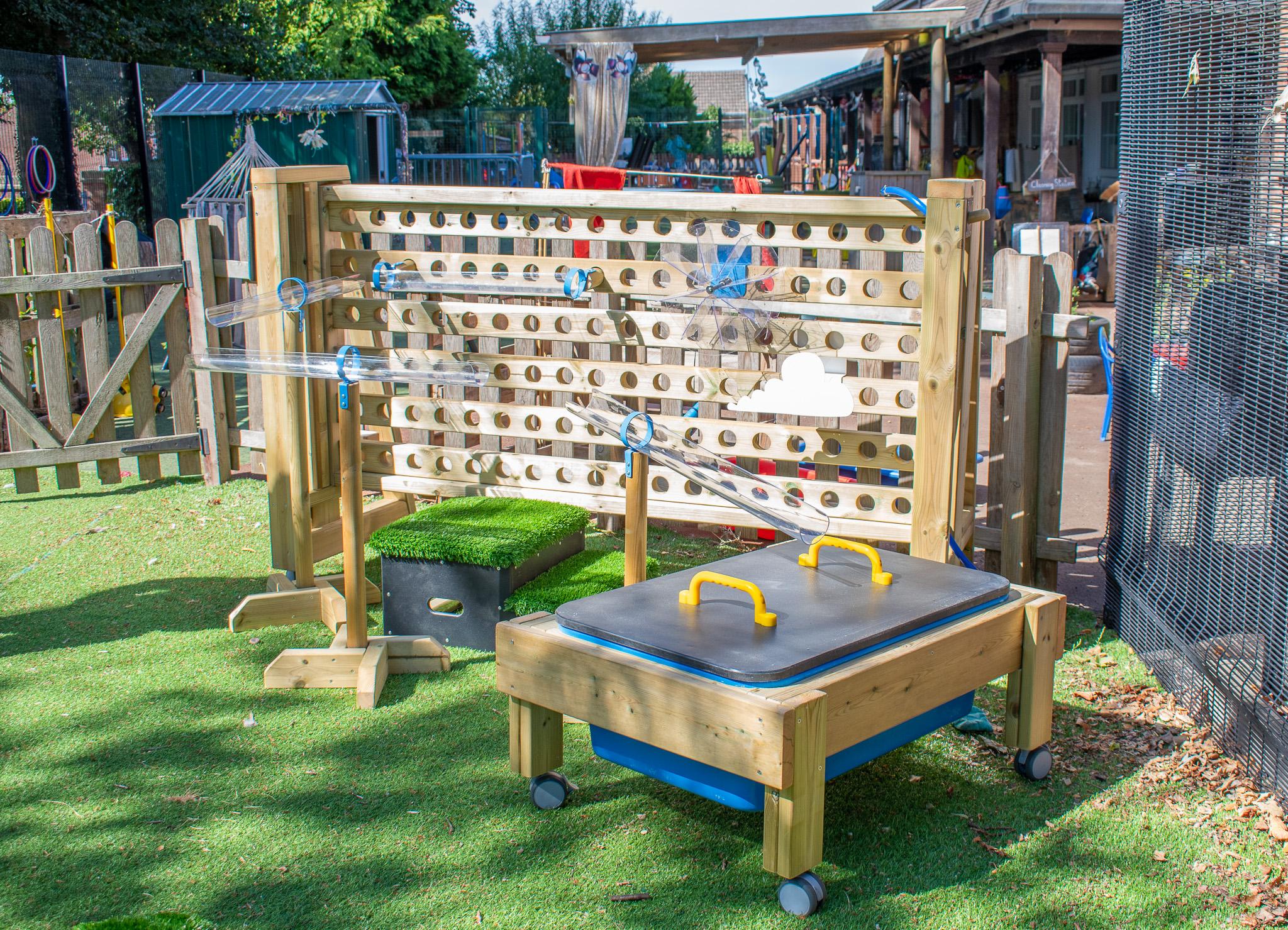 A Pentagon Play bespoke School Playground Scheme with children playing on the playground