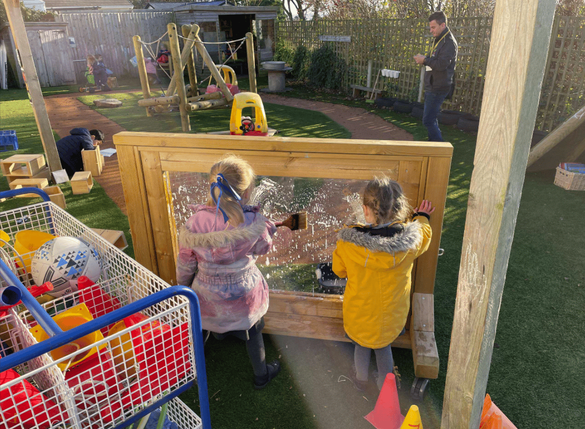 A Pentagon Play bespoke School Playground Scheme with children playing on the playground