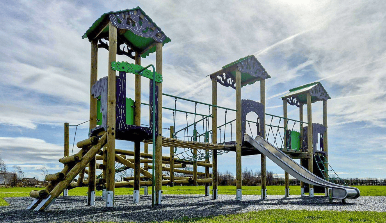 A Pentagon Play bespoke School Playground Scheme with children playing on the playground