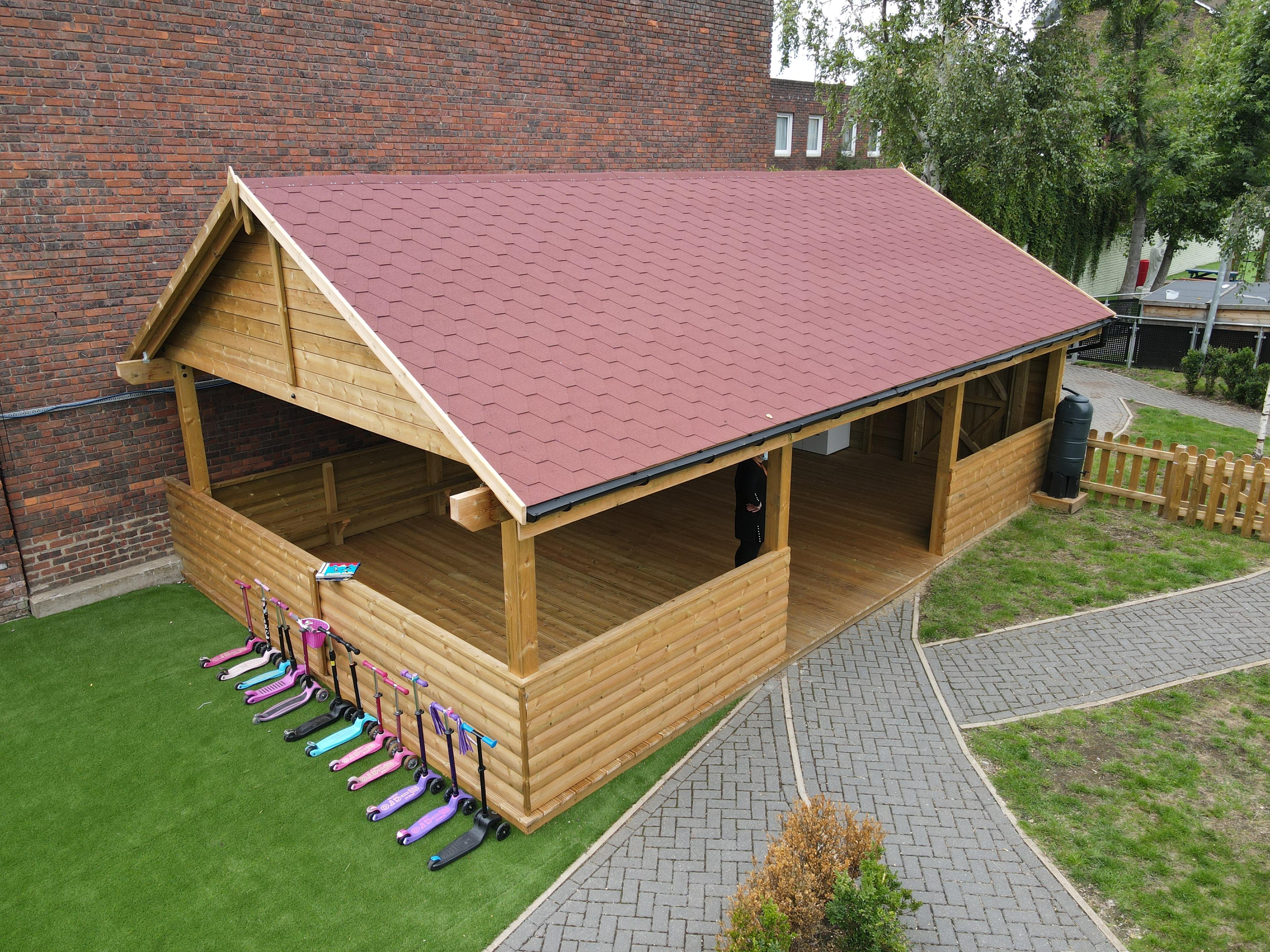 A Pentagon Play bespoke School Playground Scheme with children playing on the playground