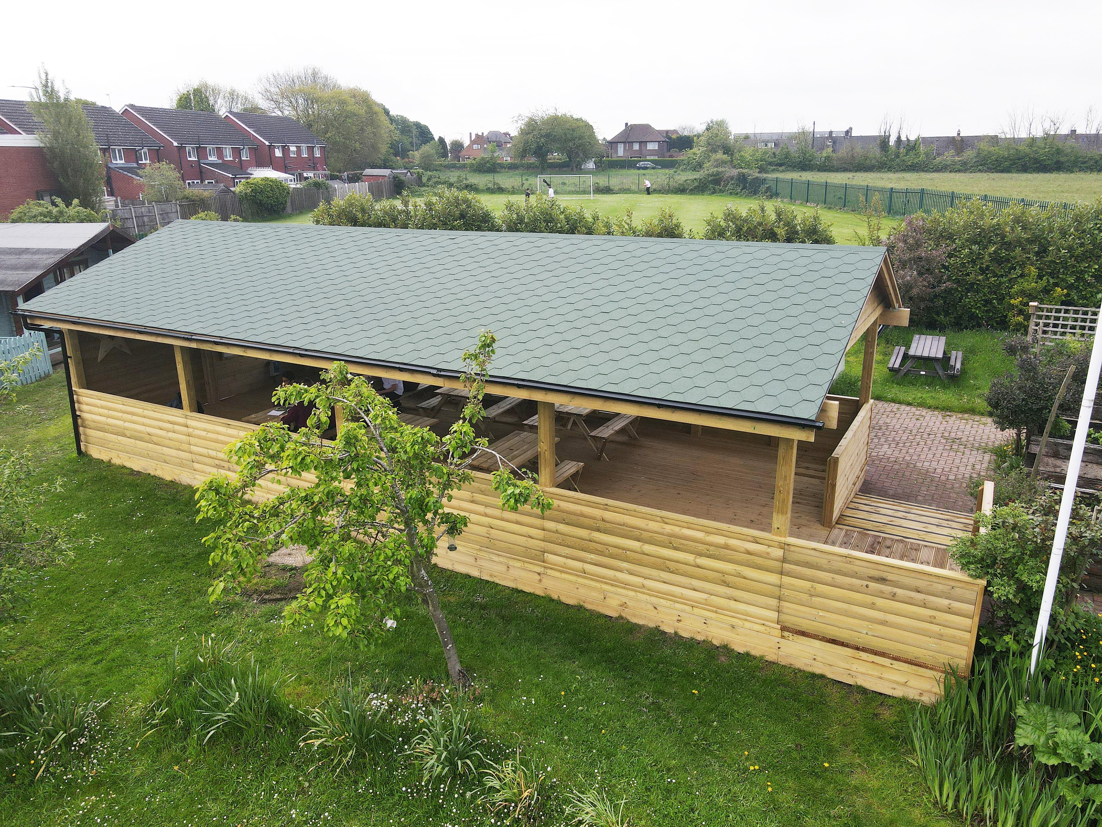 A Pentagon Play bespoke School Playground Scheme with children playing on the playground