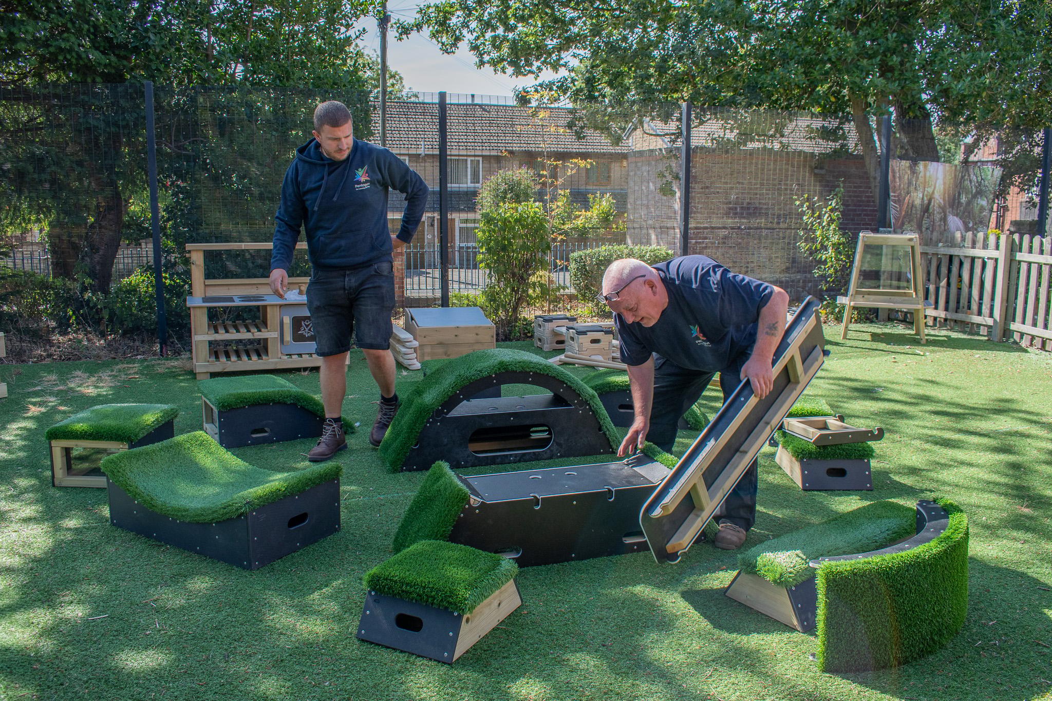 A Pentagon Play bespoke School Playground Scheme with children playing on the playground