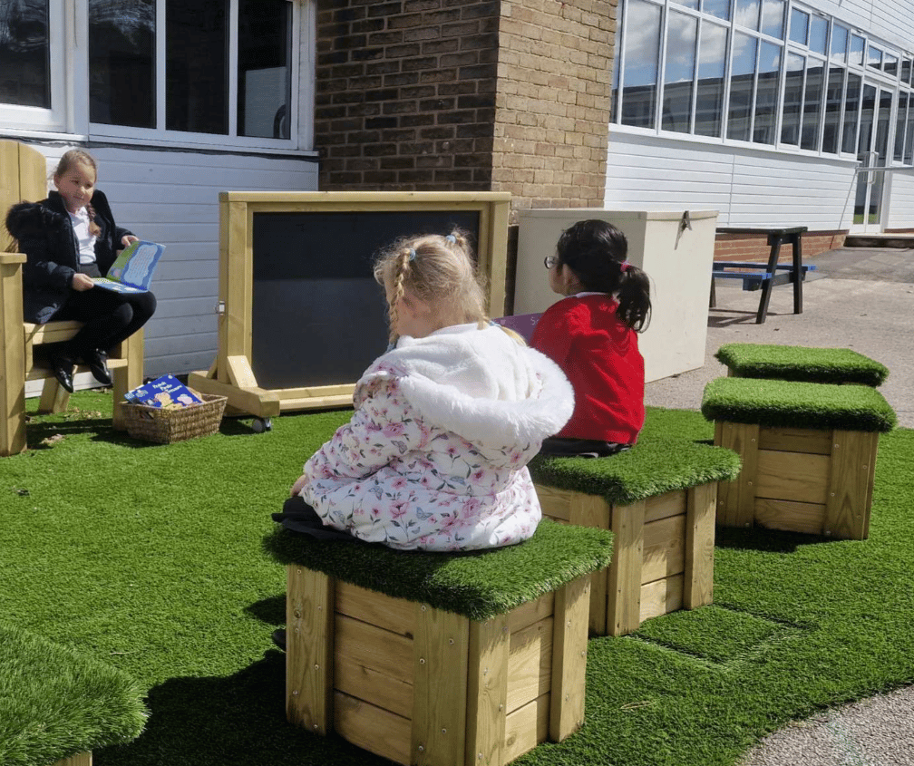 A Pentagon Play bespoke School Playground Scheme with children playing on the playground