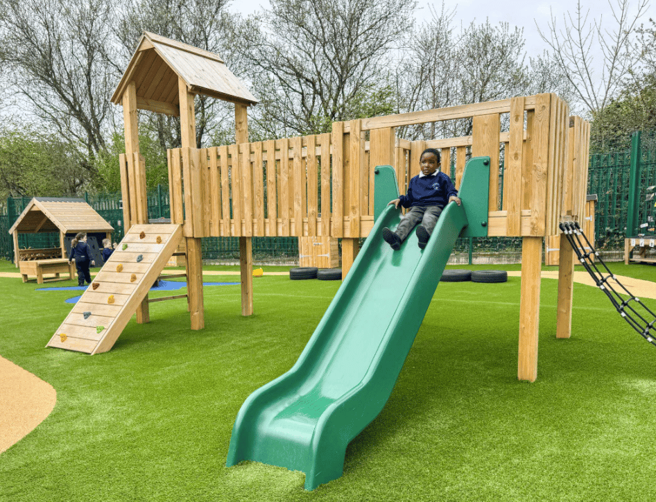 A Pentagon Play bespoke School Playground Scheme with children playing on the playground