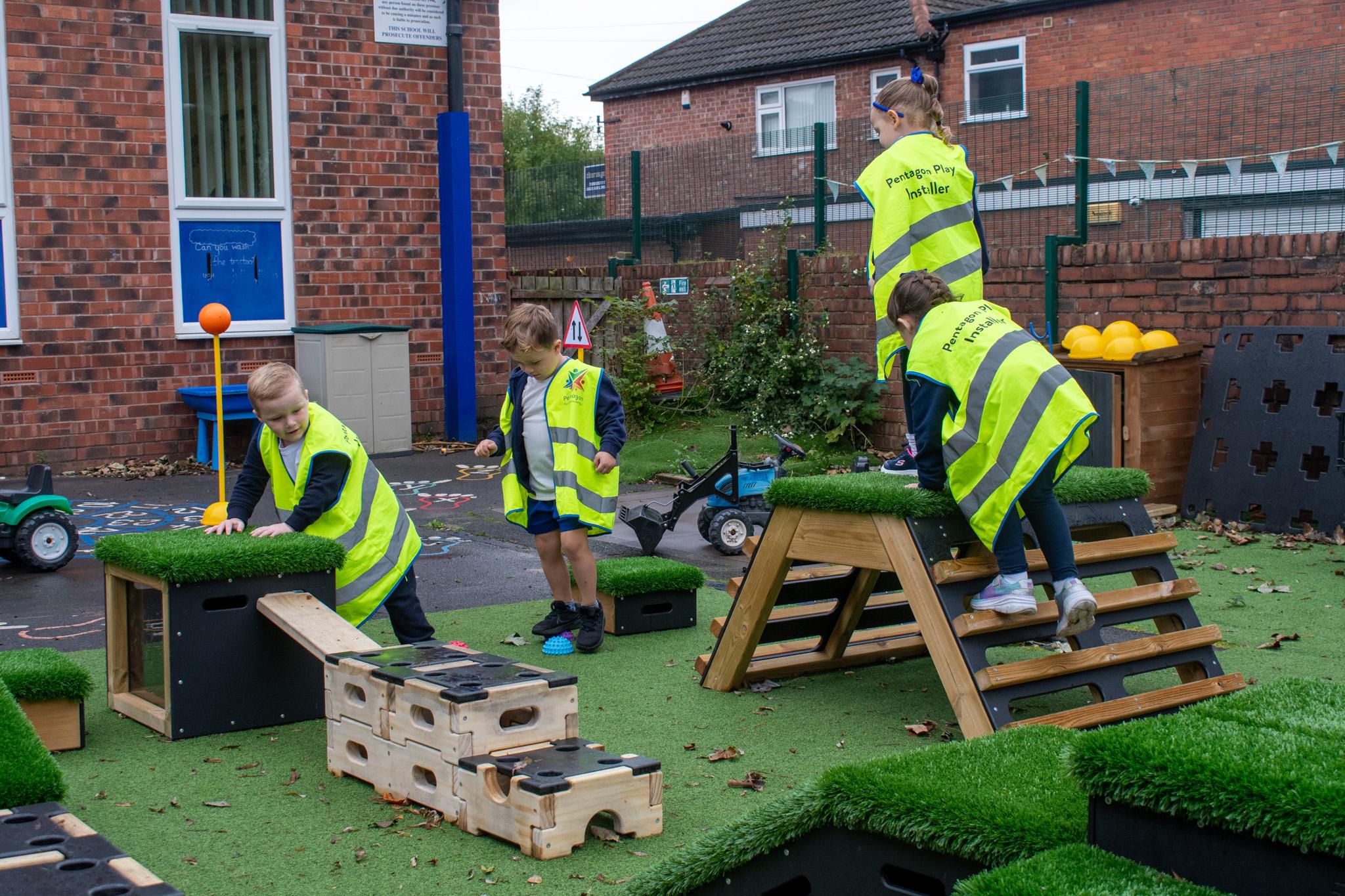 A Pentagon Play bespoke School Playground Scheme with children playing on the playground